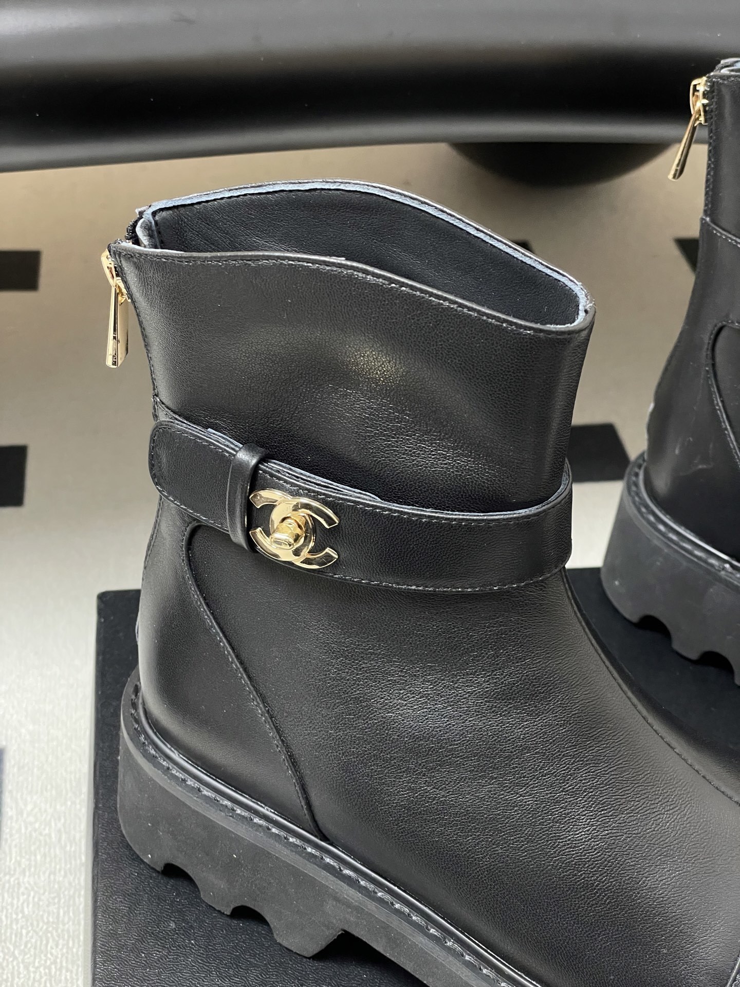 Women's Black Leather Lug Sole Ankle Boots with Gold Hardware