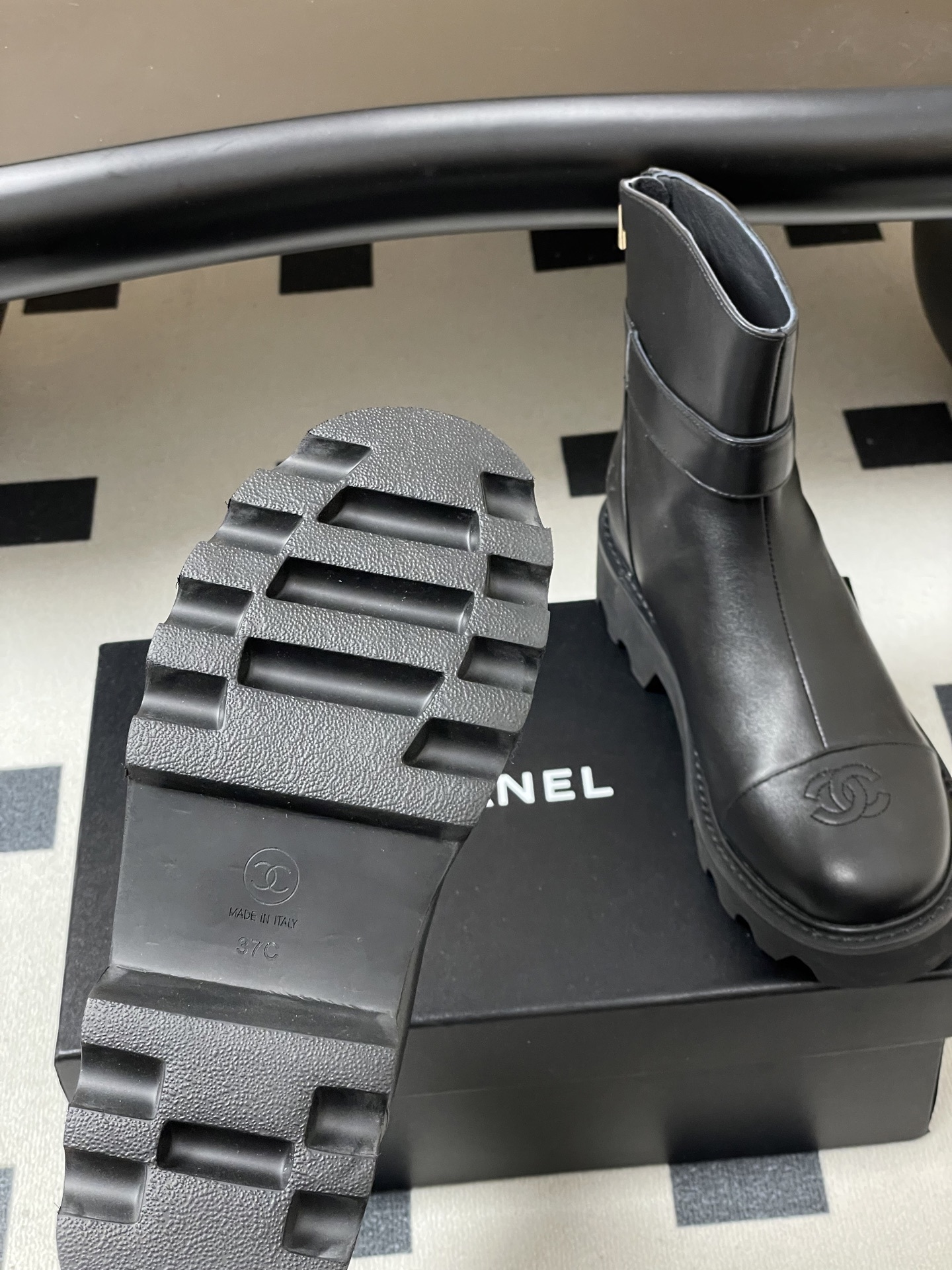 Women's Black Leather Lug Sole Ankle Boots with Gold Hardware