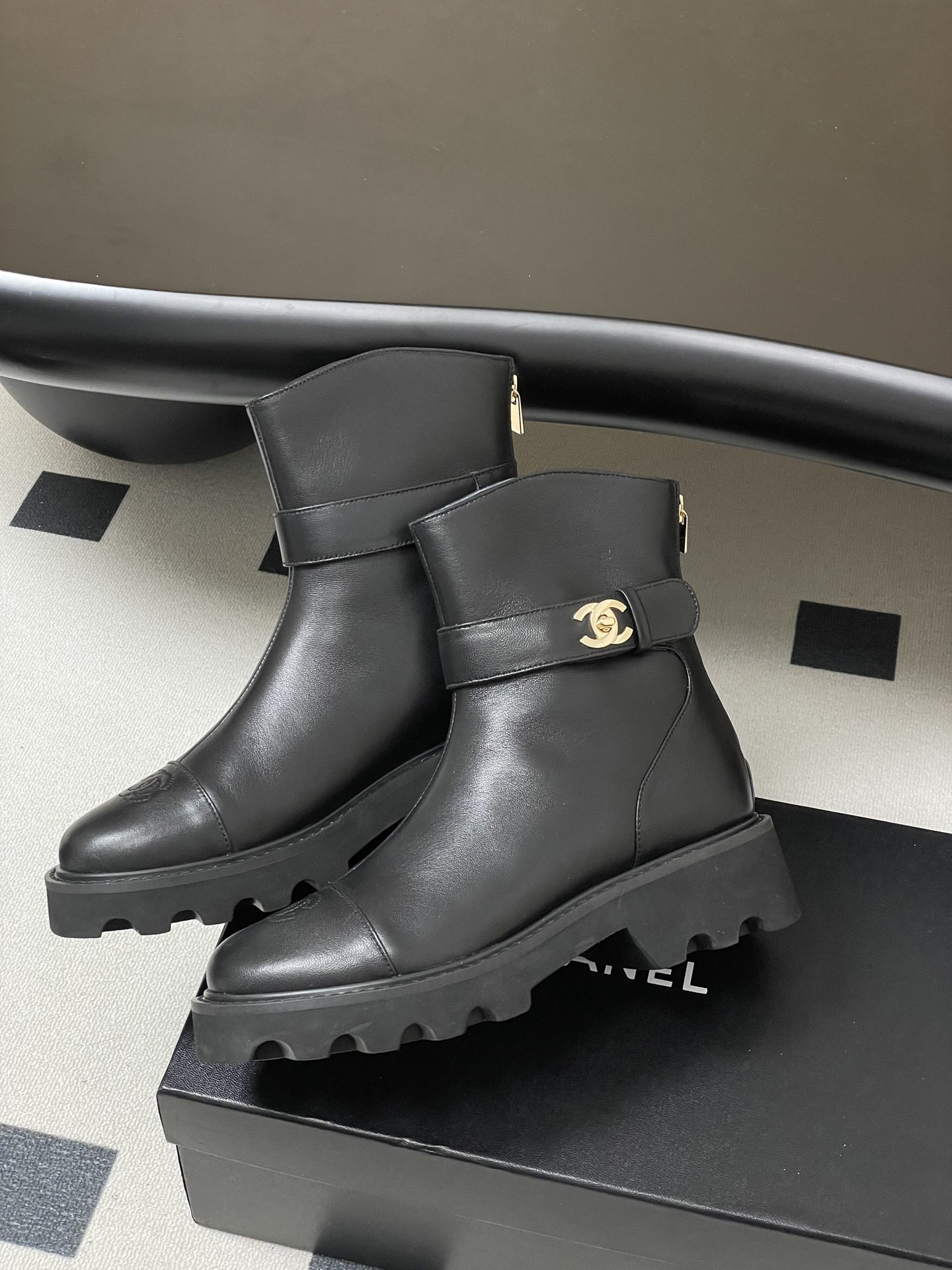 Women's Black Leather Lug Sole Ankle Boots with Gold Hardware