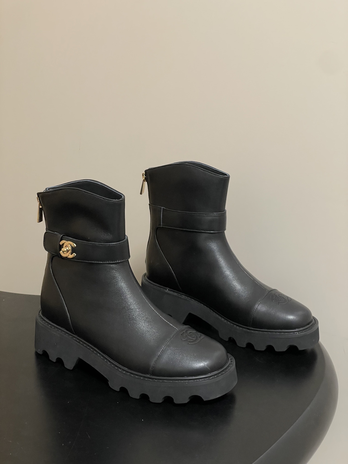 Women’s Black Leather Lug Sole Ankle Boots with Gold Hardware
