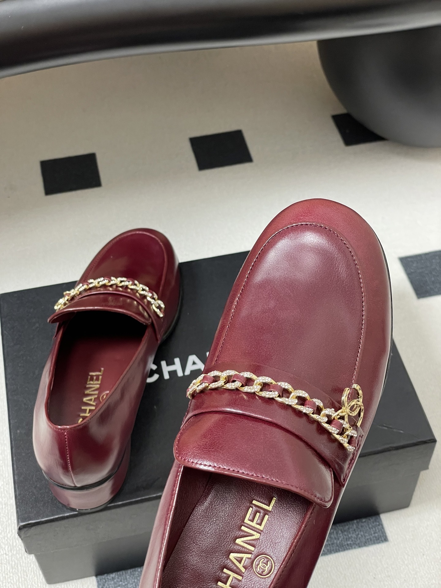 Luxury Burgundy Leather Loafers with Gold Chain Detail