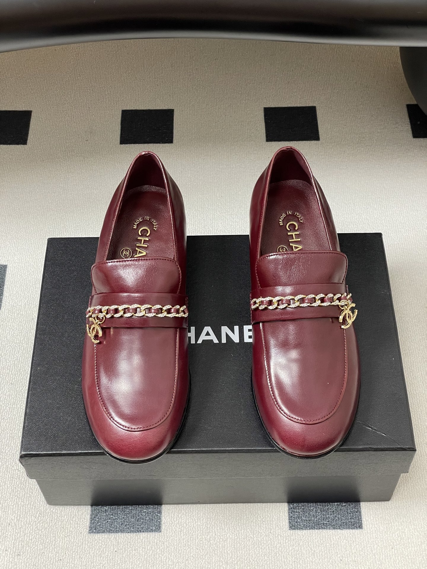 Luxury Burgundy Leather Loafers with Gold Chain Detail