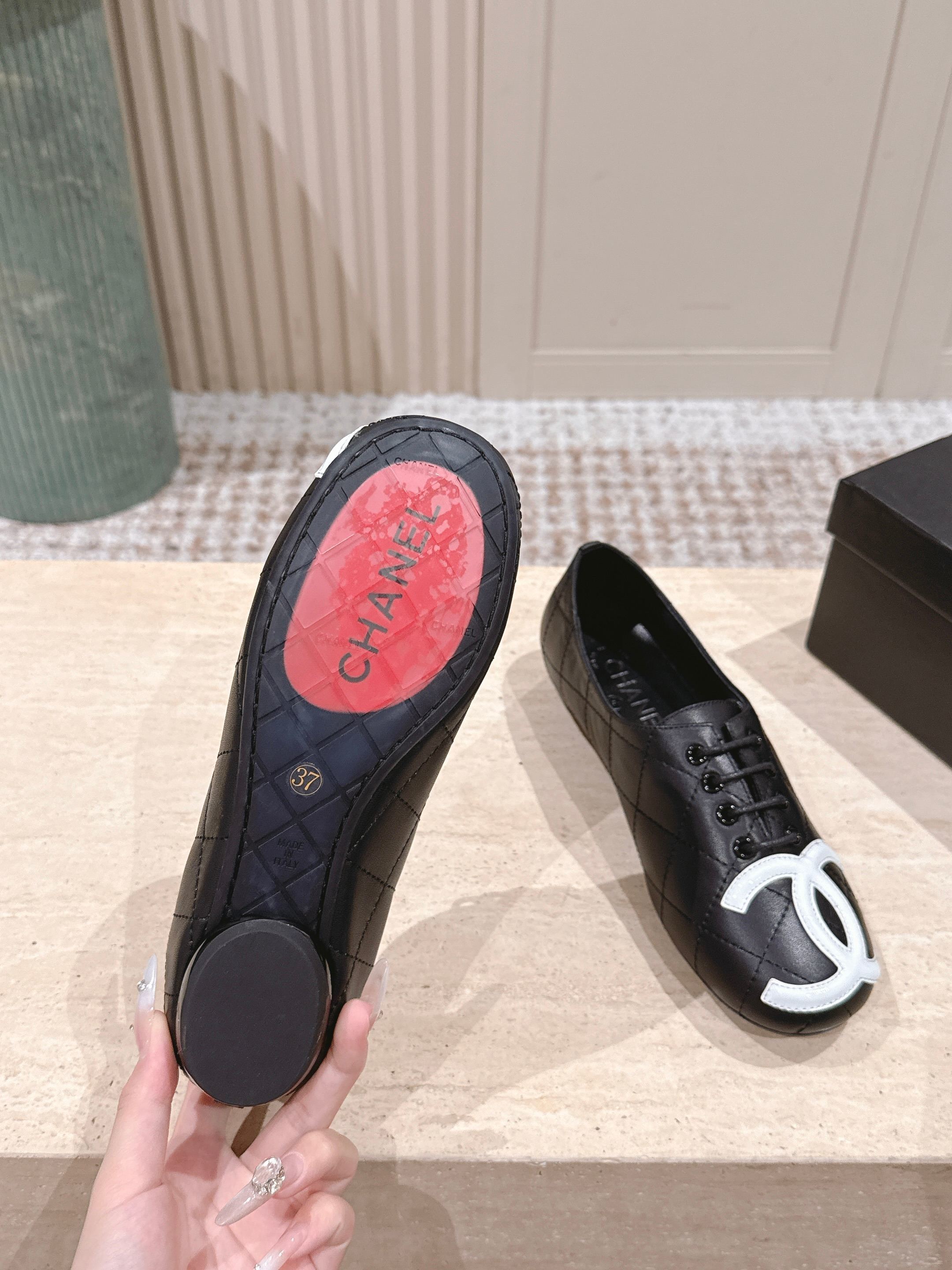 Chanel Quilted Black Leather Flats with White CC Logo