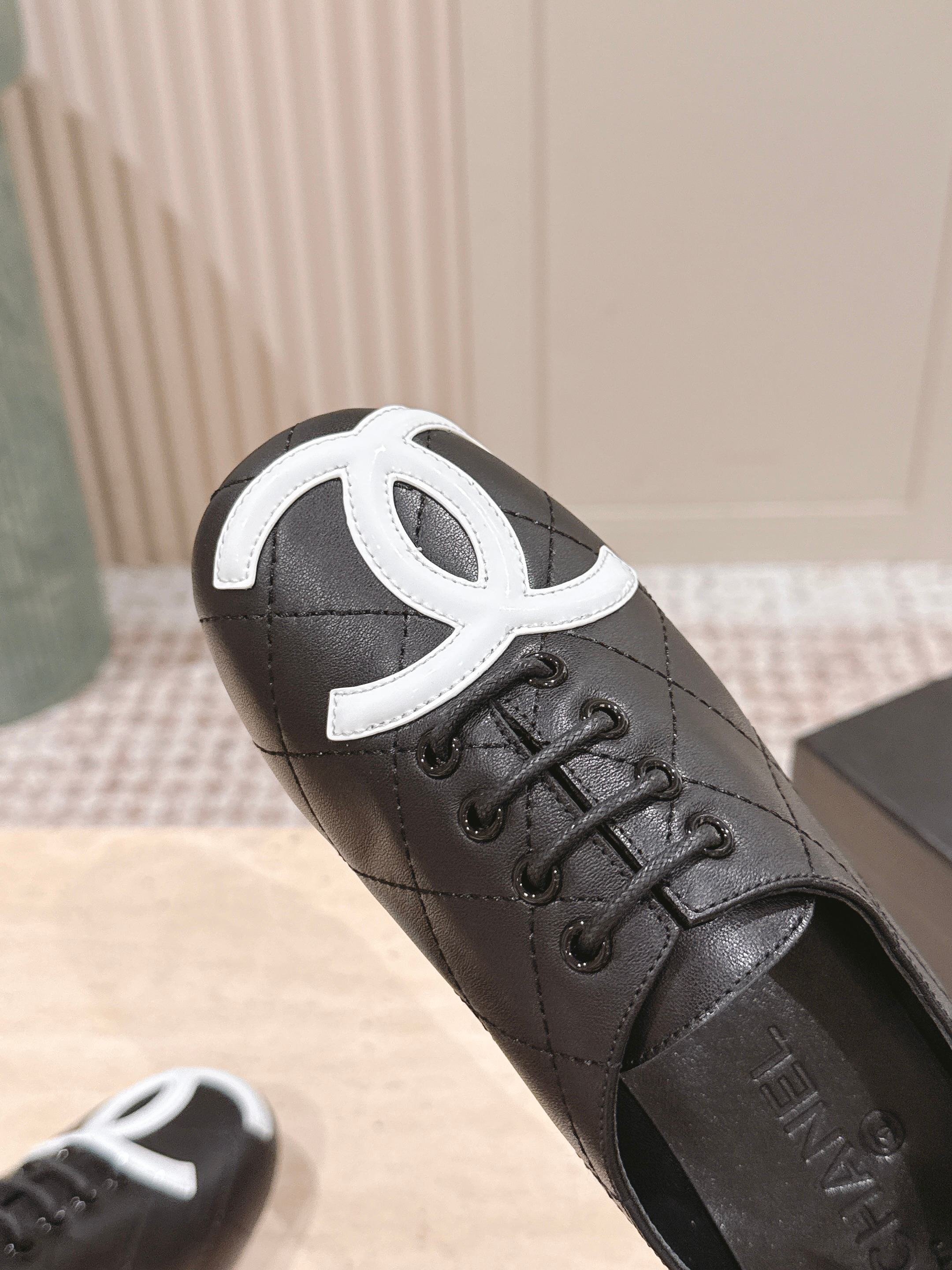 Chanel Quilted Black Leather Flats with White CC Logo