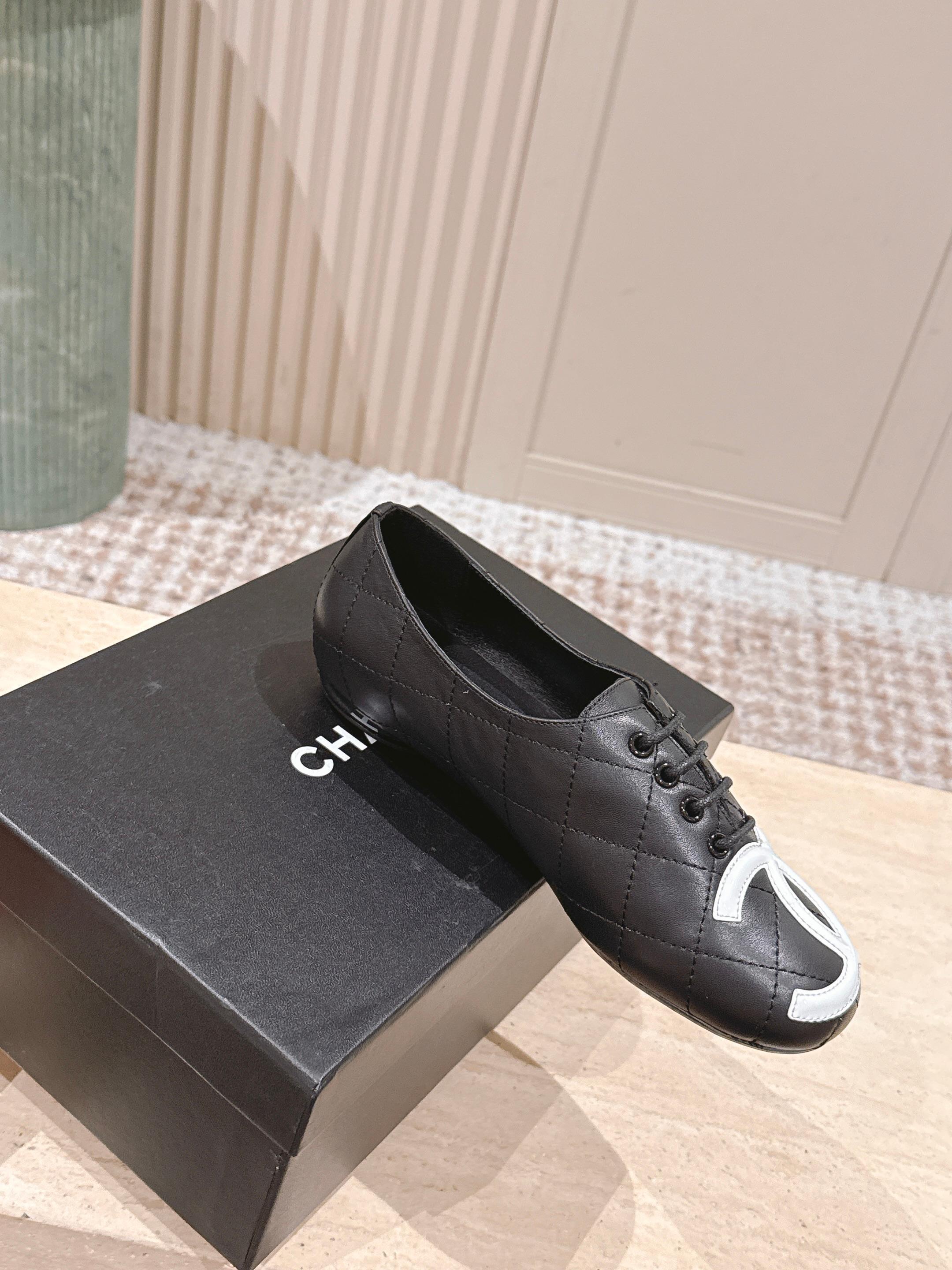 Chanel Quilted Black Leather Flats with White CC Logo