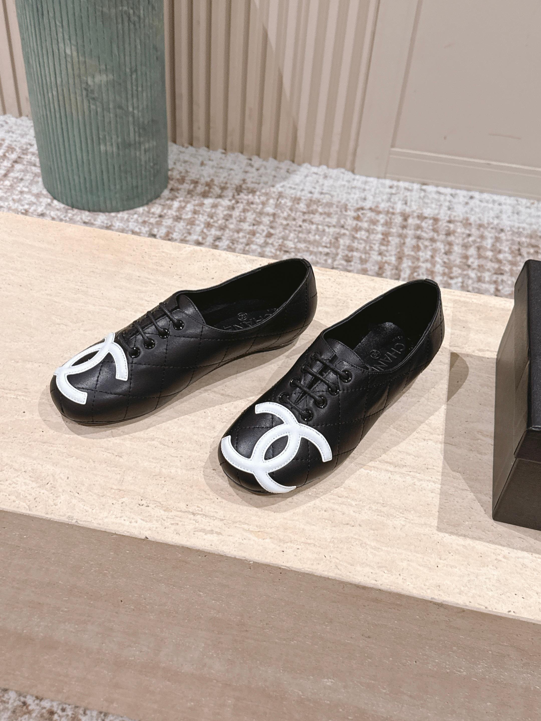 Chanel Quilted Black Leather Flats with White CC Logo