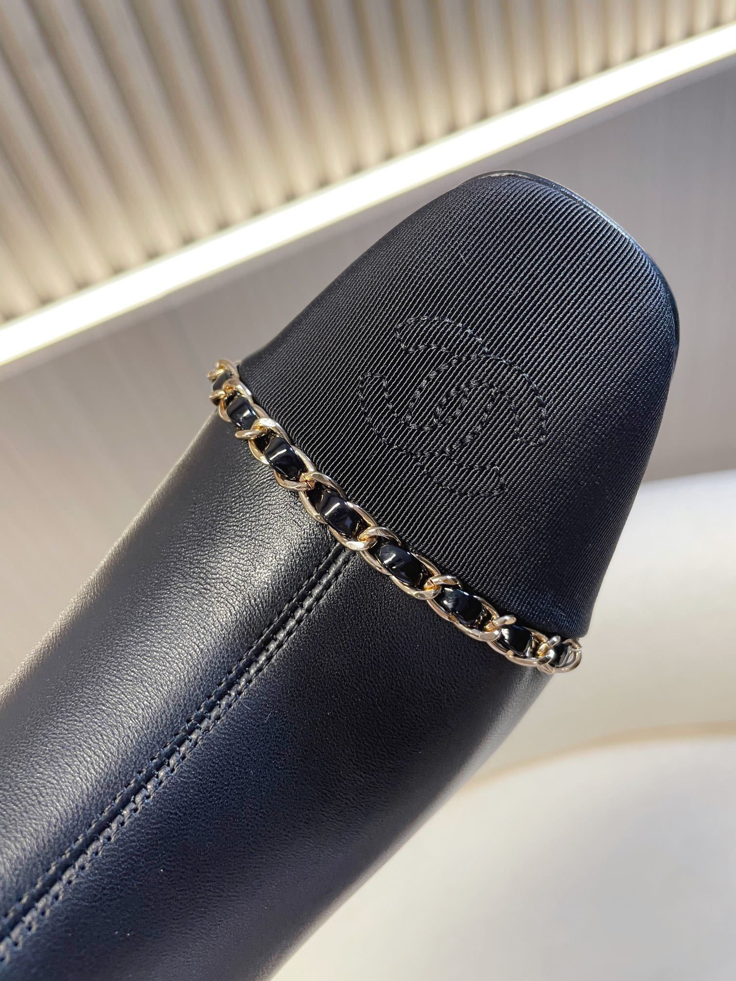 Chanel Black Leather Ankle Boots with Gold Chain Detail