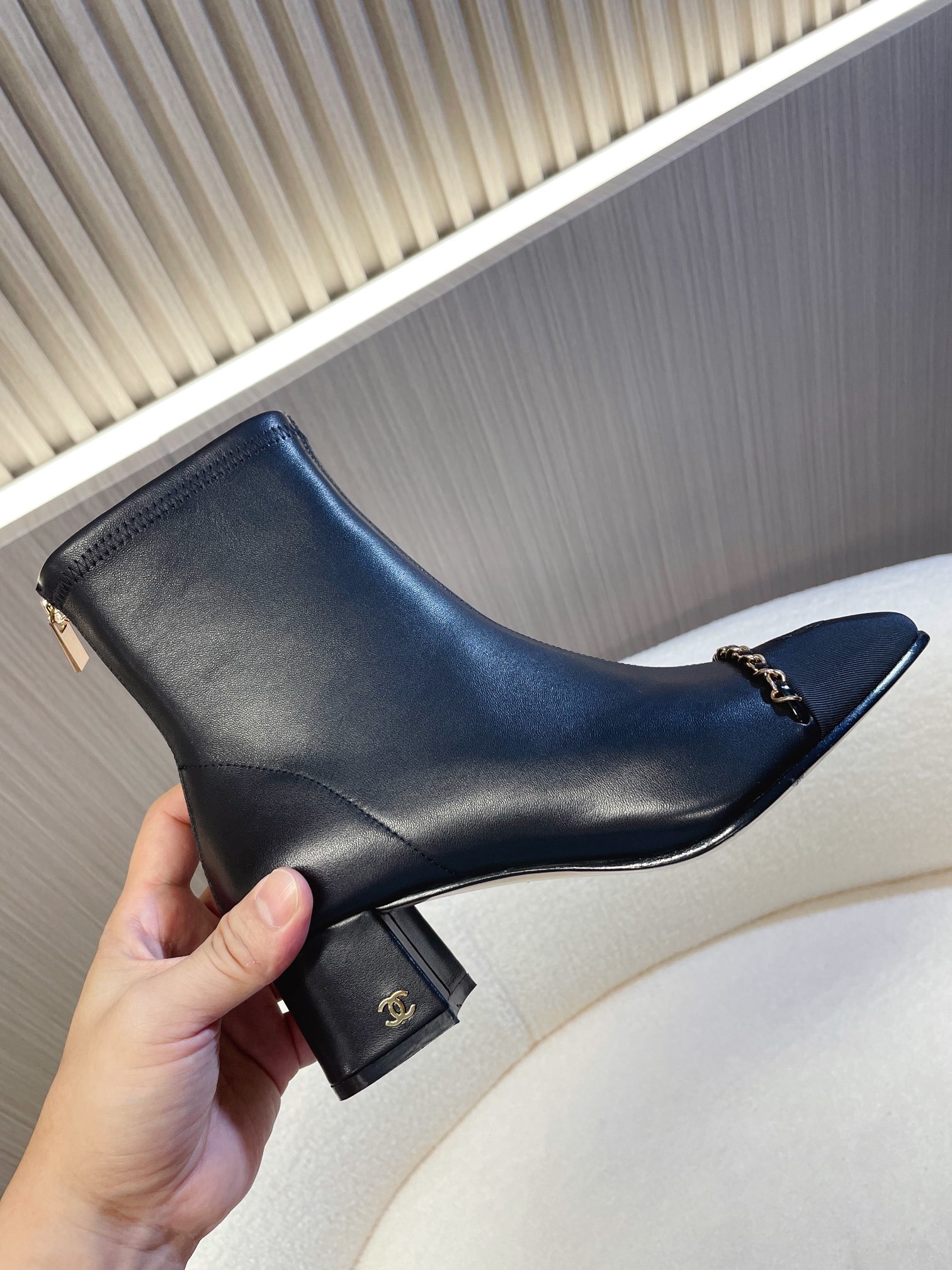 Chanel Black Leather Ankle Boots with Gold Chain Detail