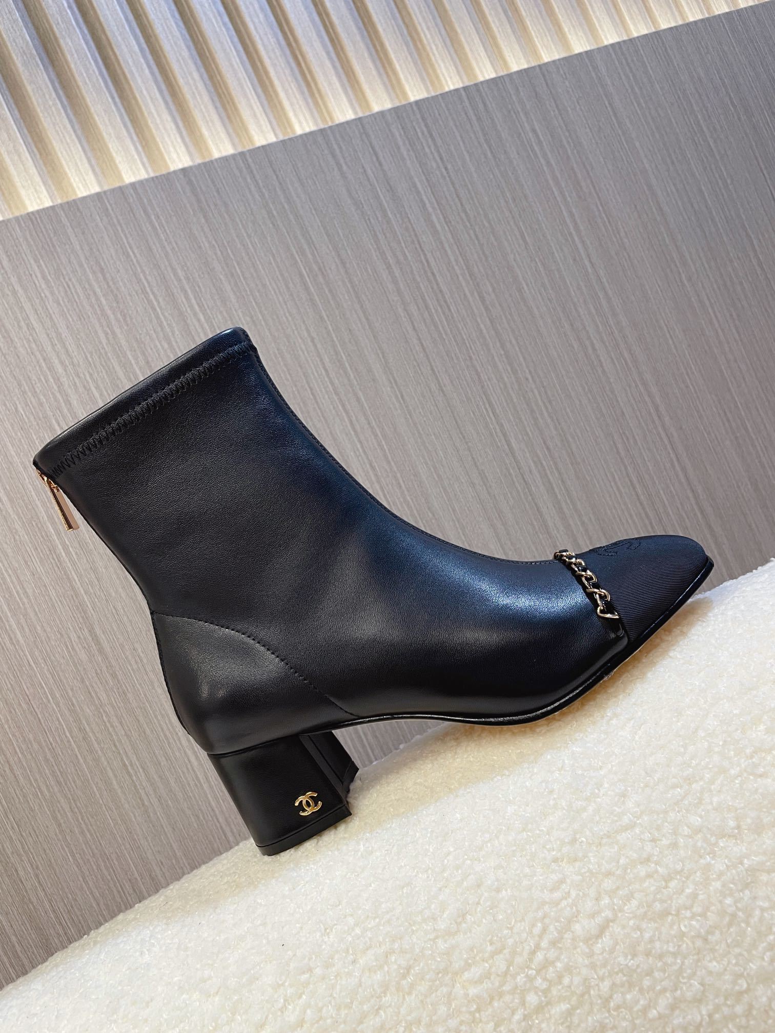 Chanel Black Leather Ankle Boots with Gold Chain Detail