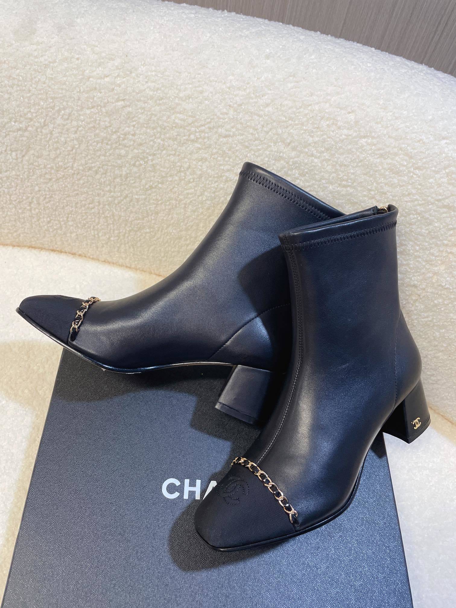 Chanel Black Leather Ankle Boots with Gold Chain Detail