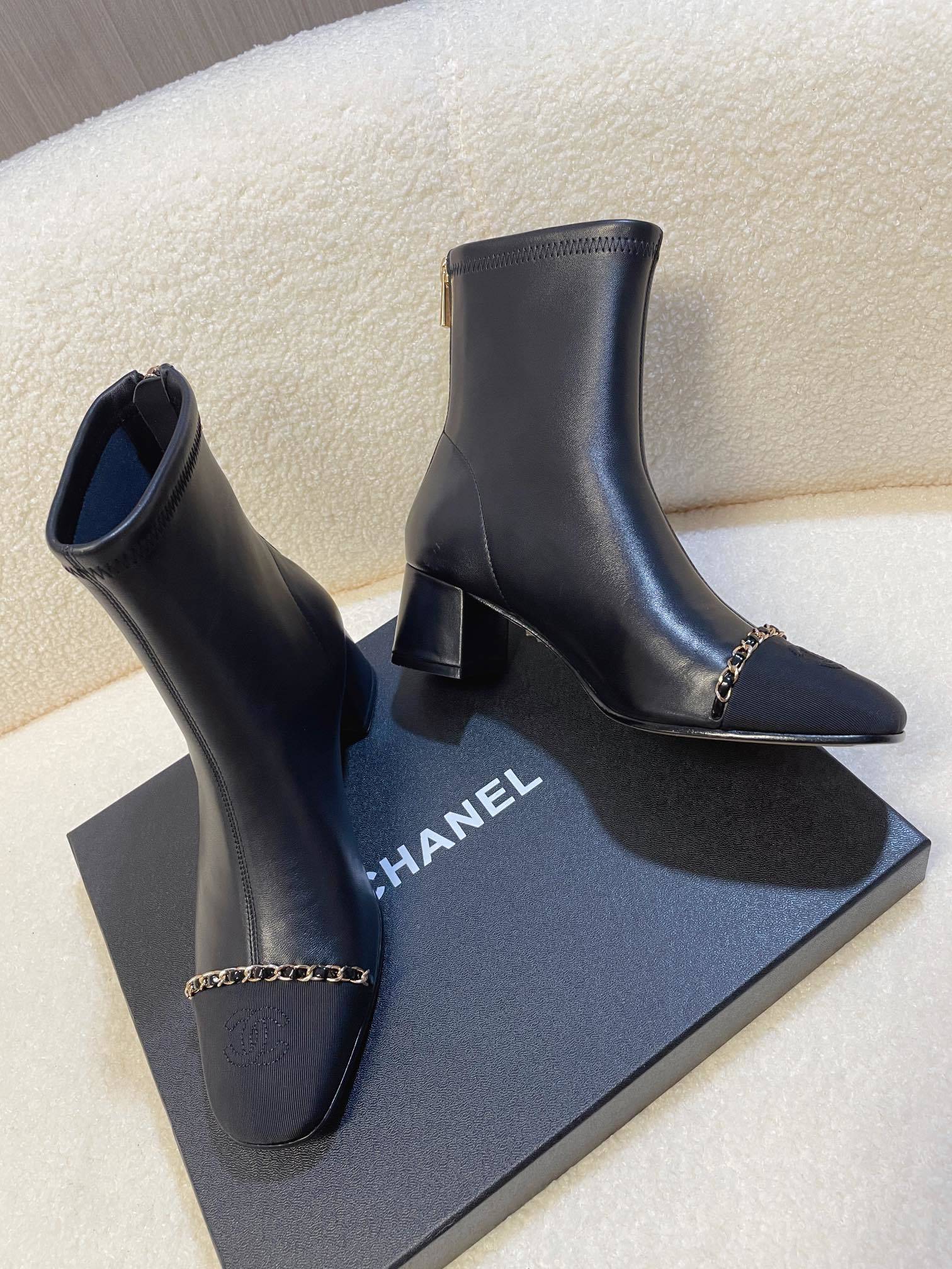 Chanel Black Leather Ankle Boots with Gold Chain Detail