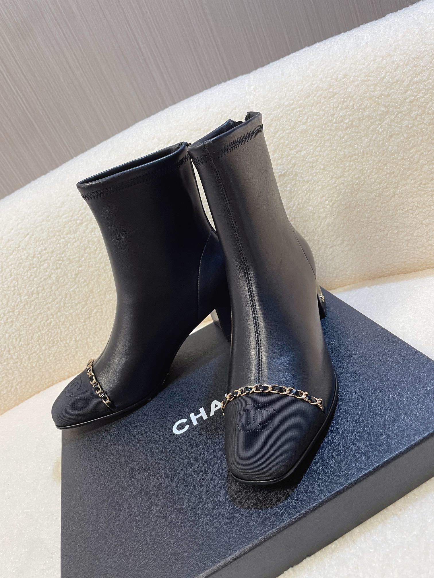 Chanel Black Leather Ankle Boots with Gold Chain Detail