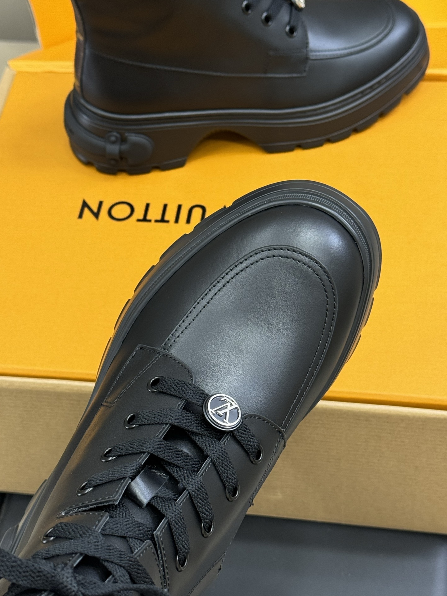 Luxury Black Leather Combat Boots with Monogram Trim Detail