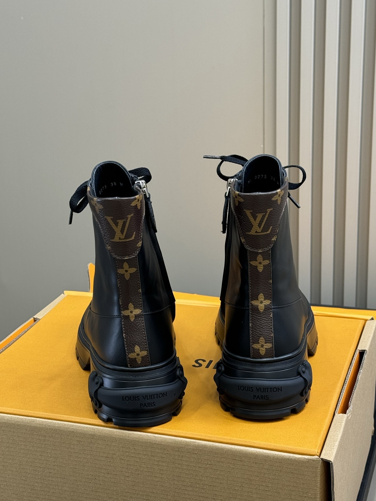 Luxury Black Leather Combat Boots with Monogram Trim Detail