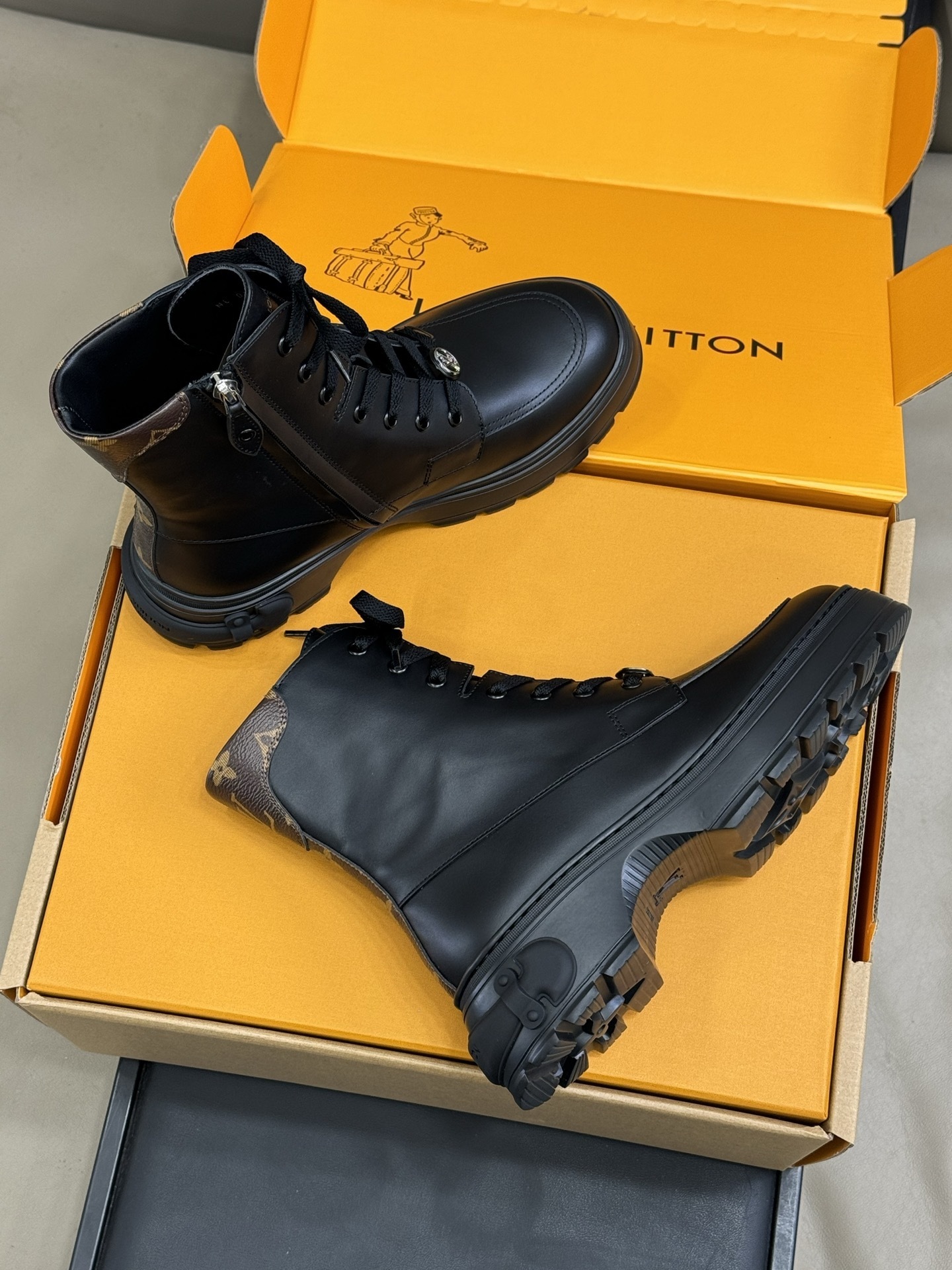 Luxury Black Leather Combat Boots with Monogram Trim Detail