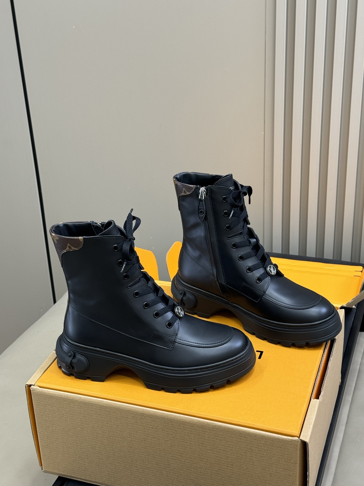 Luxury Black Leather Combat Boots with Monogram Trim Detail