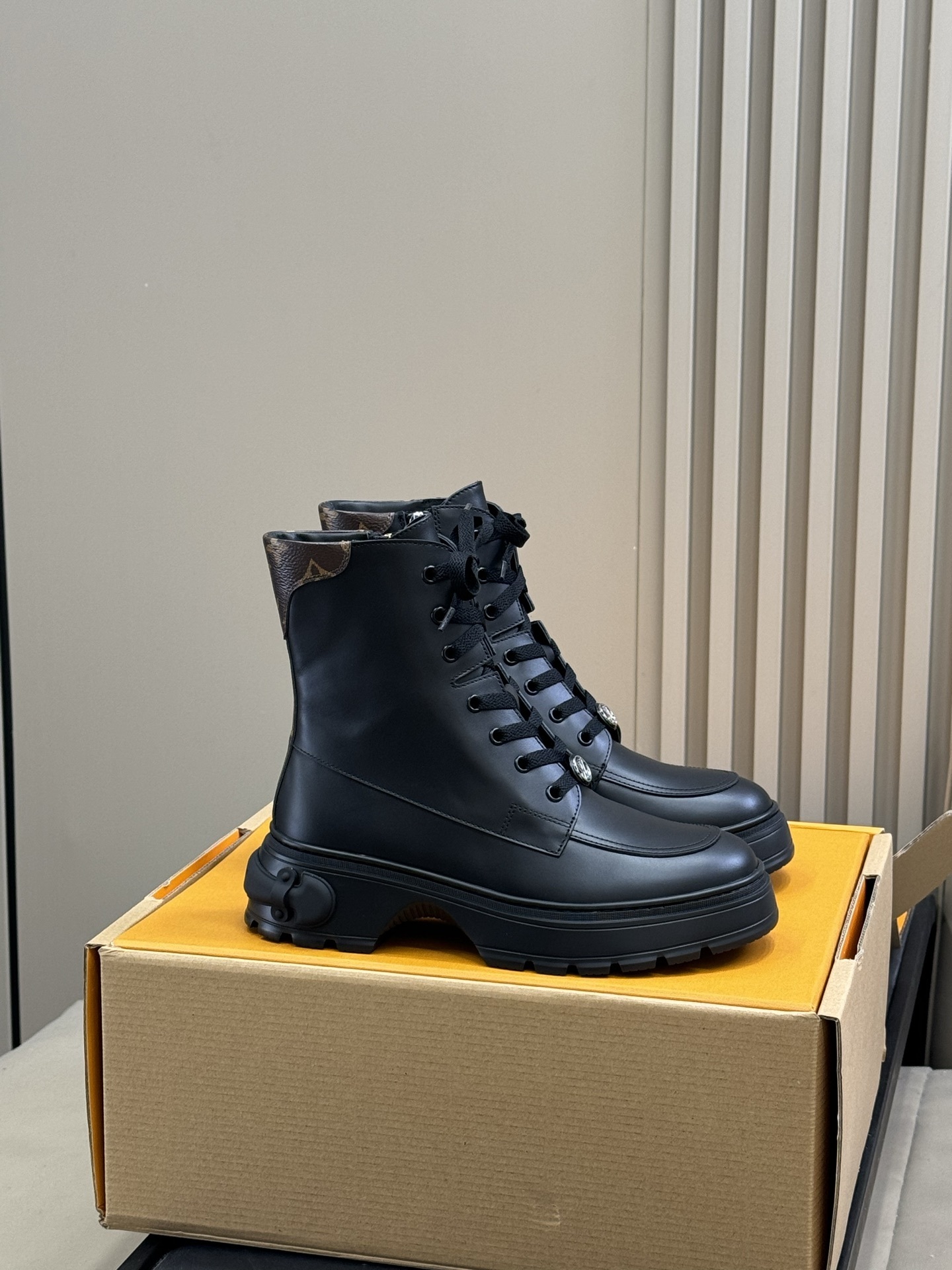 Luxury Black Leather Combat Boots with Monogram Trim Detail
