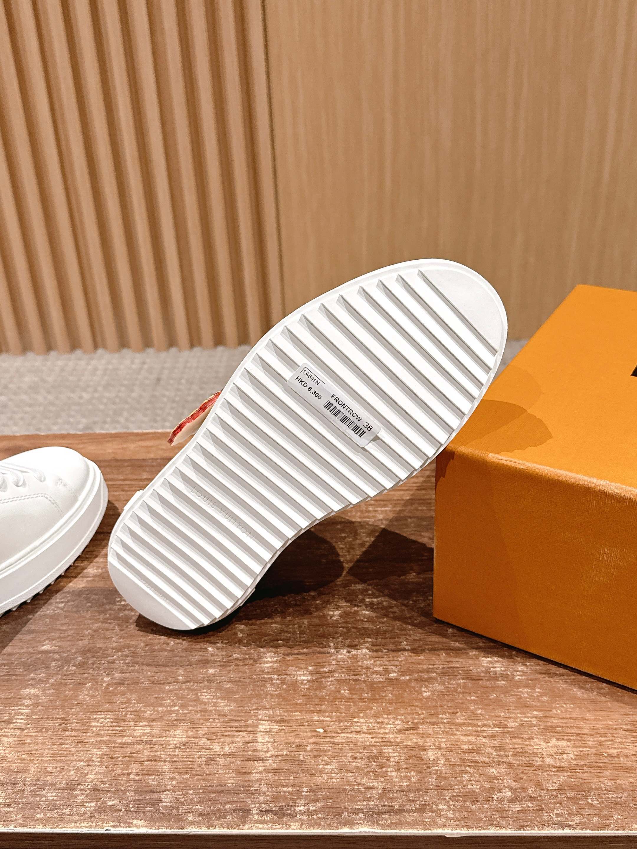 Louis Vuitton Women's White Leather Sneakers with Gold Accents