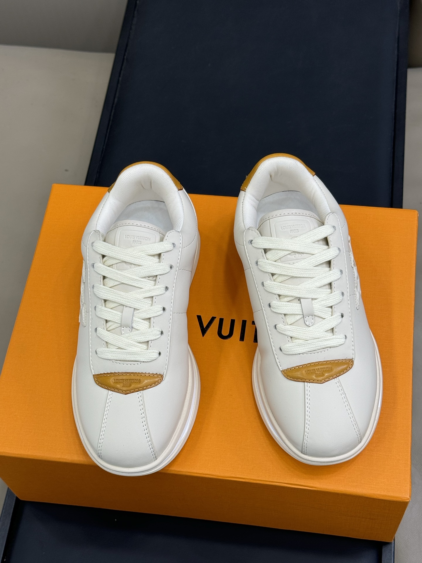 Louis Vuitton Menâ€™s White Leather Sneakers with Orange Detail â€“ Low Top Trainers