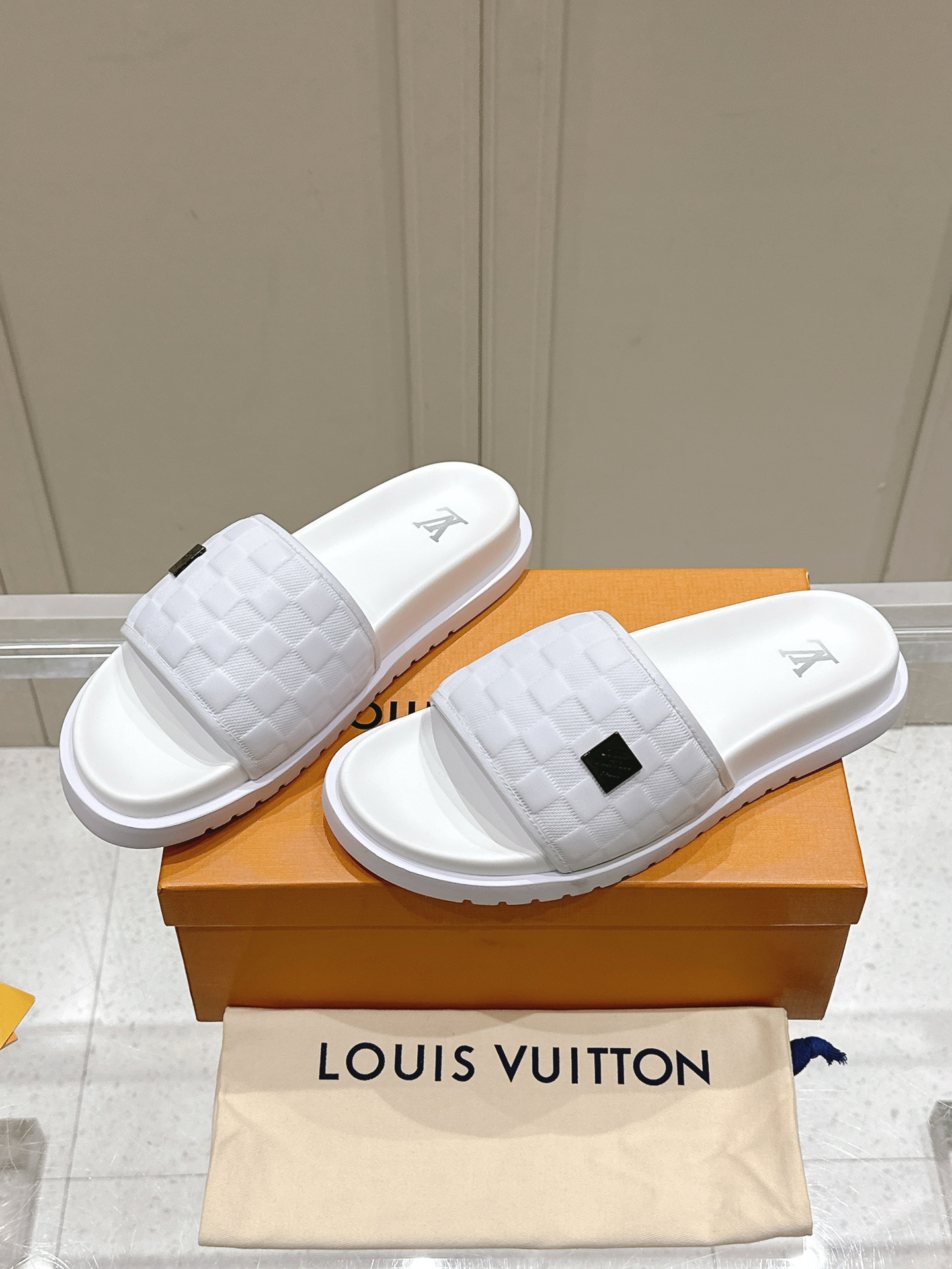 Louis Vuitton Menâ€™s White Slide Sandals Embossed Pattern, Rubber Sole, Slip-On Comfort