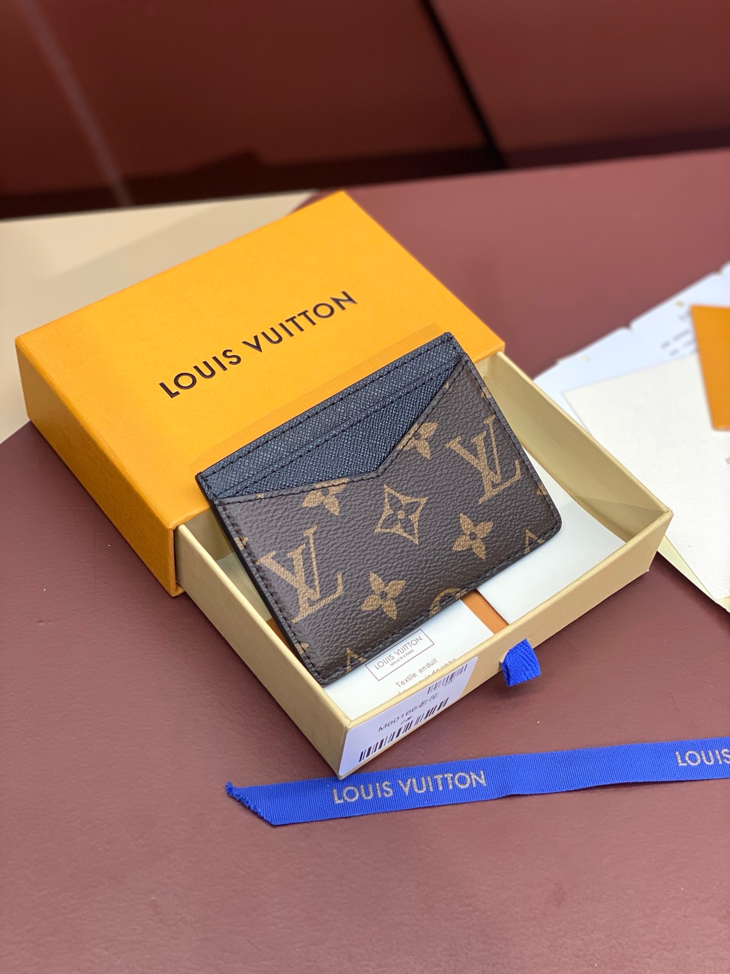 Louis Vuitton men’s wallet with brown floral card holder