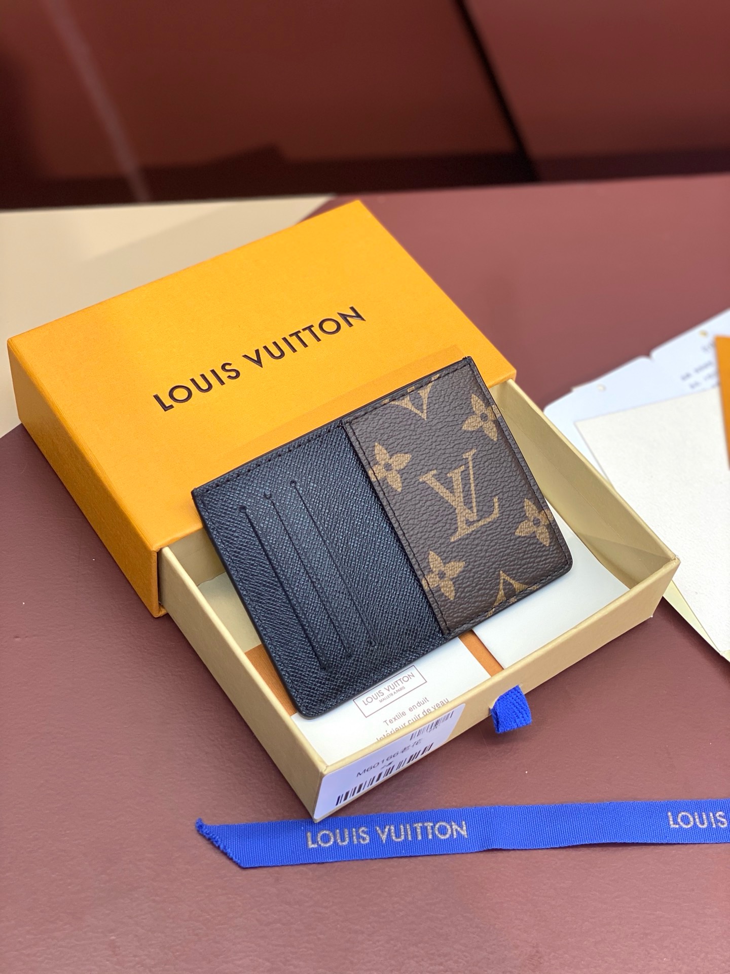 Louis Vuitton men’s wallet with brown floral card holder