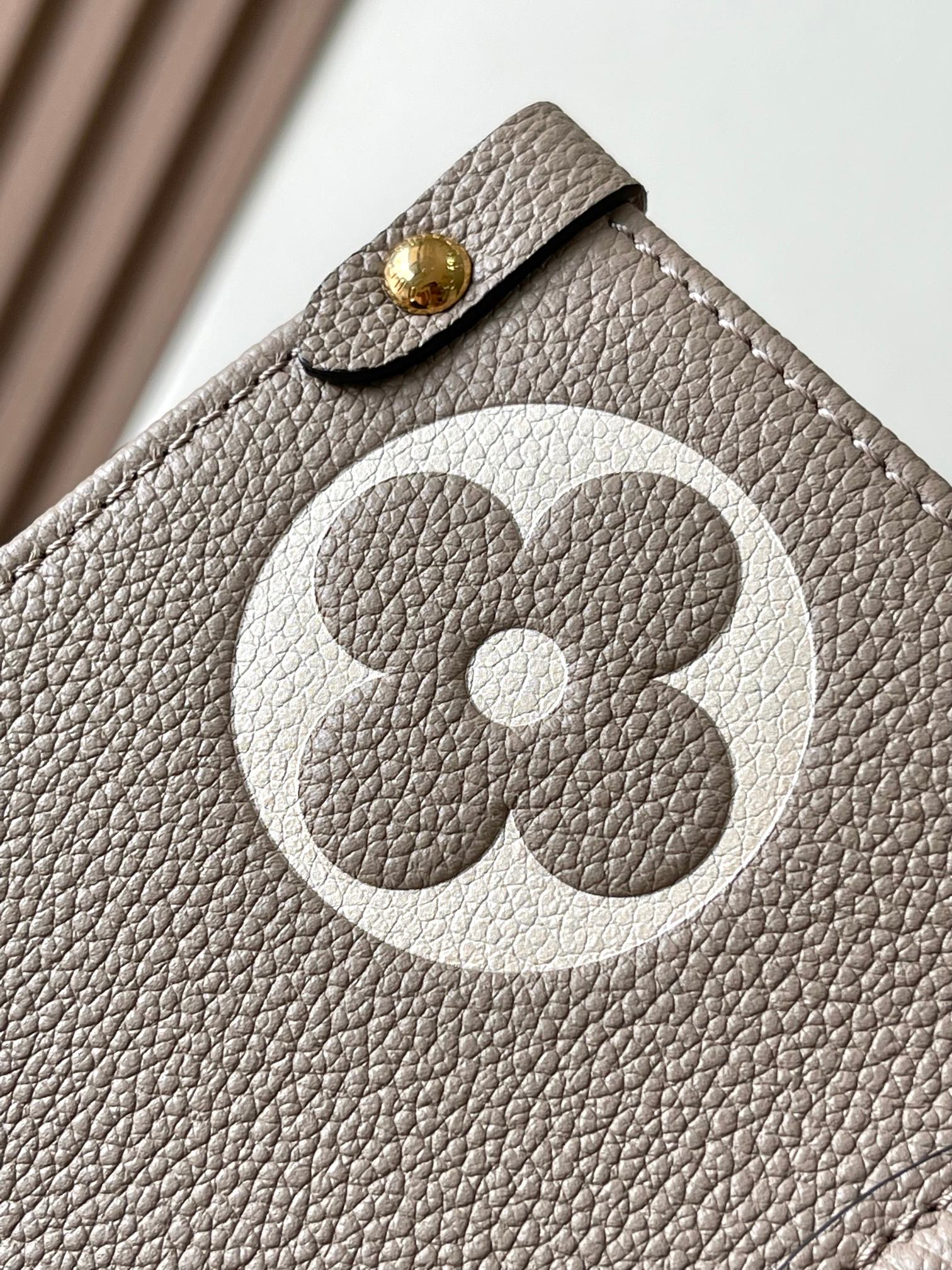 LOUIS VUITTON OnTheGo MM Leather Bicolor Monogram Empreinte Bag Gray