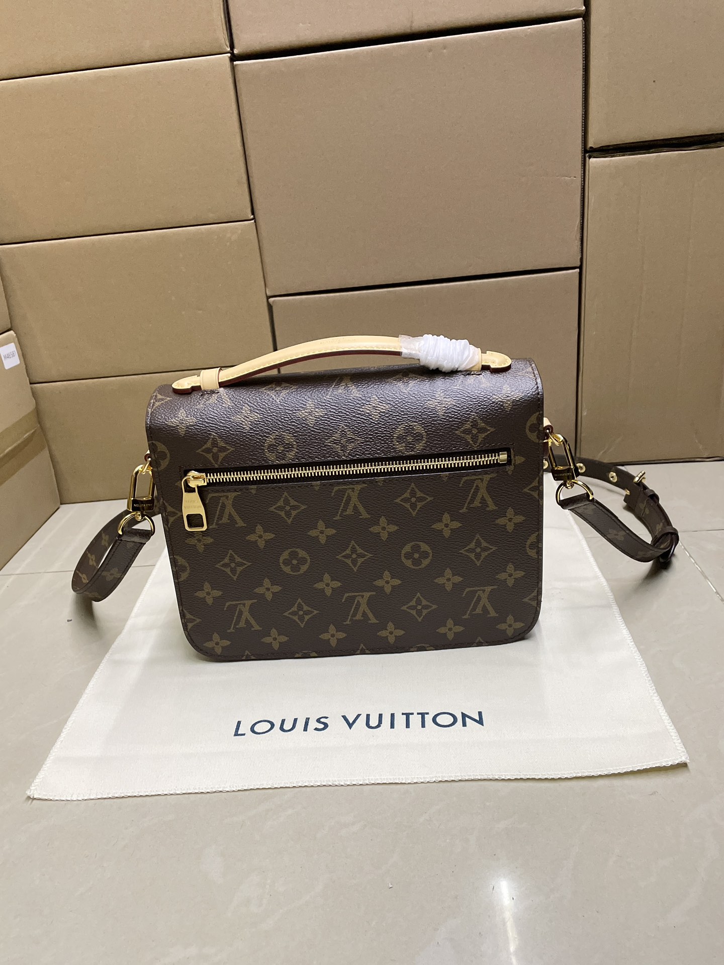 LOUIS VUITTON Pochette Métis East West Monogram Bag Brown