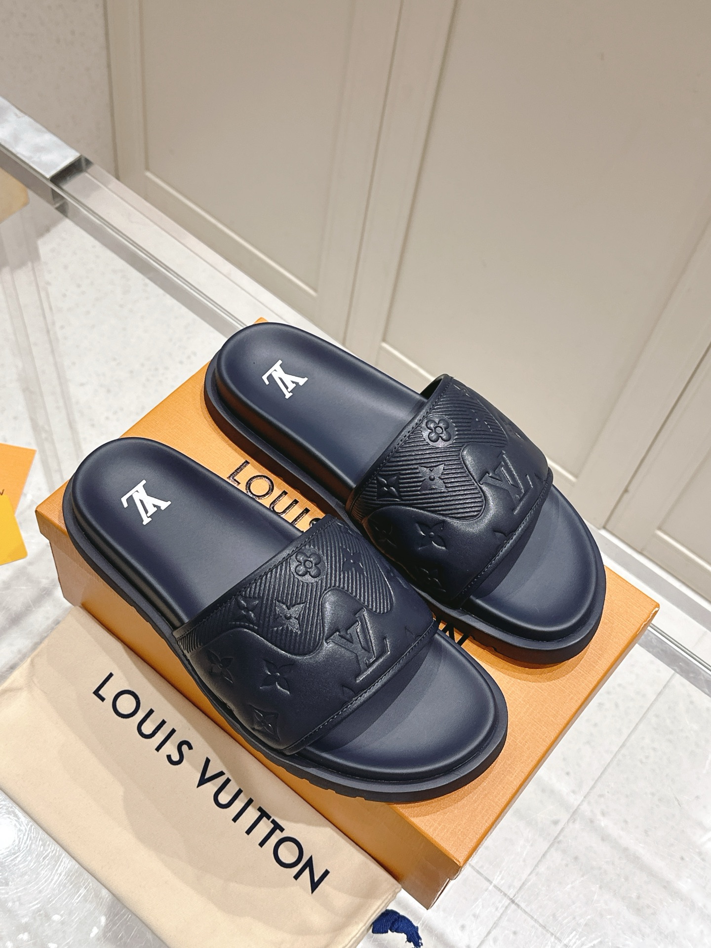 Louis Vuitton Waterfront Black Embossed Leather Slides