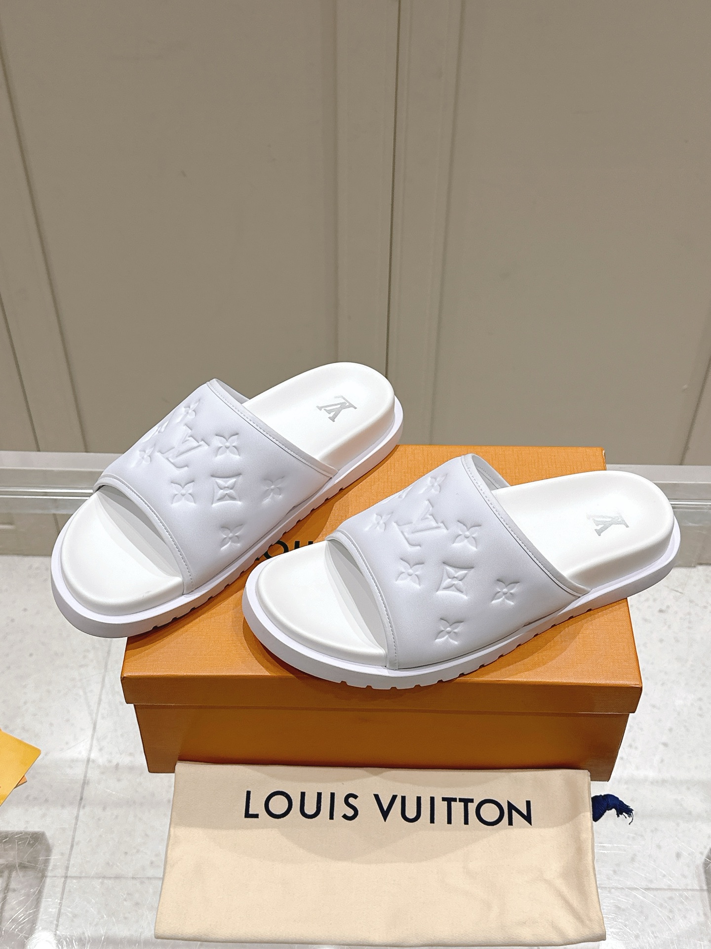 Louis Vuitton White Embossed Monogram Slide Sandals