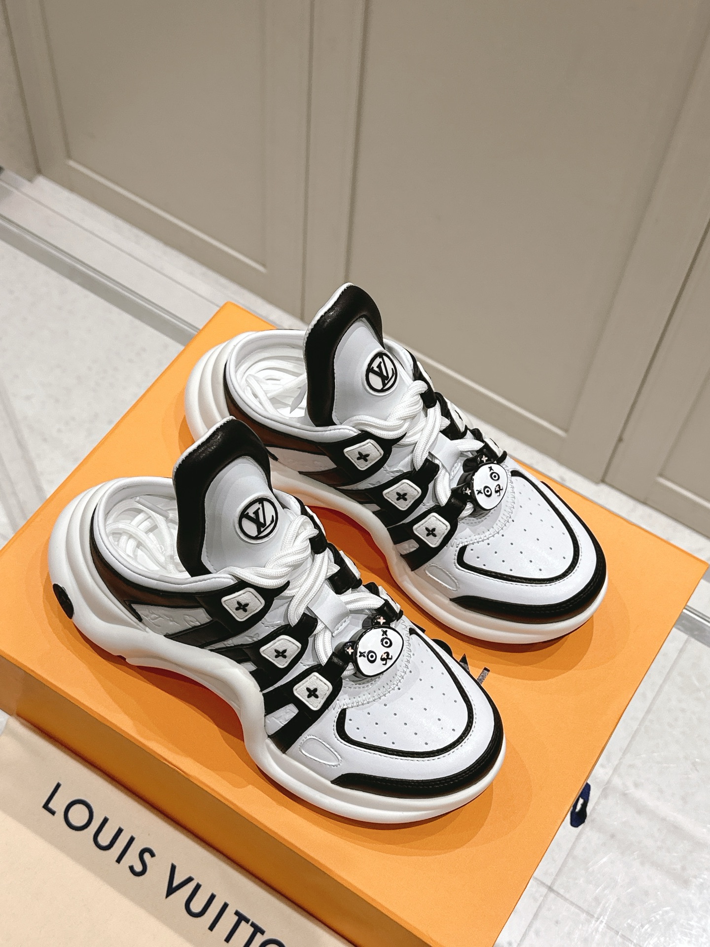 LV ARCHLIGHT SNEAKER IN WHITE MIX BLACK EMBOSSED