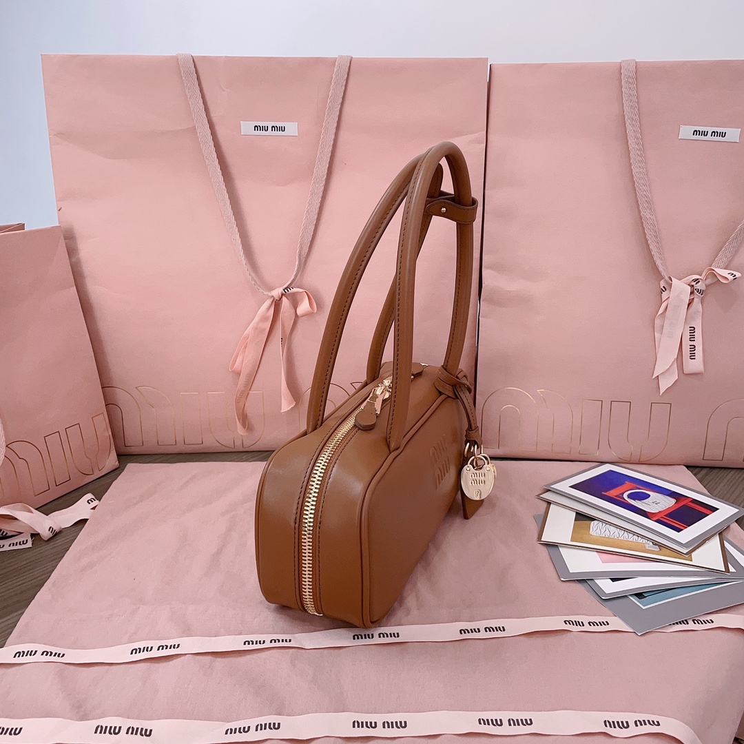 Miu Miu Beau logo embossed leather tote bag in brown - Miu Miu