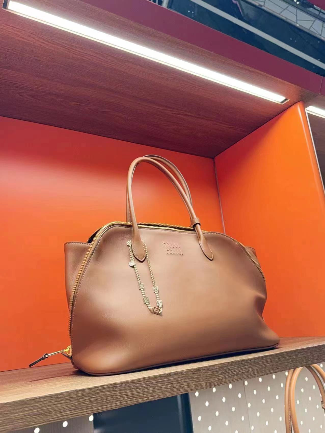 Miu Miu embossed-logo Tote Bag | Brown  Miu Miu  03359