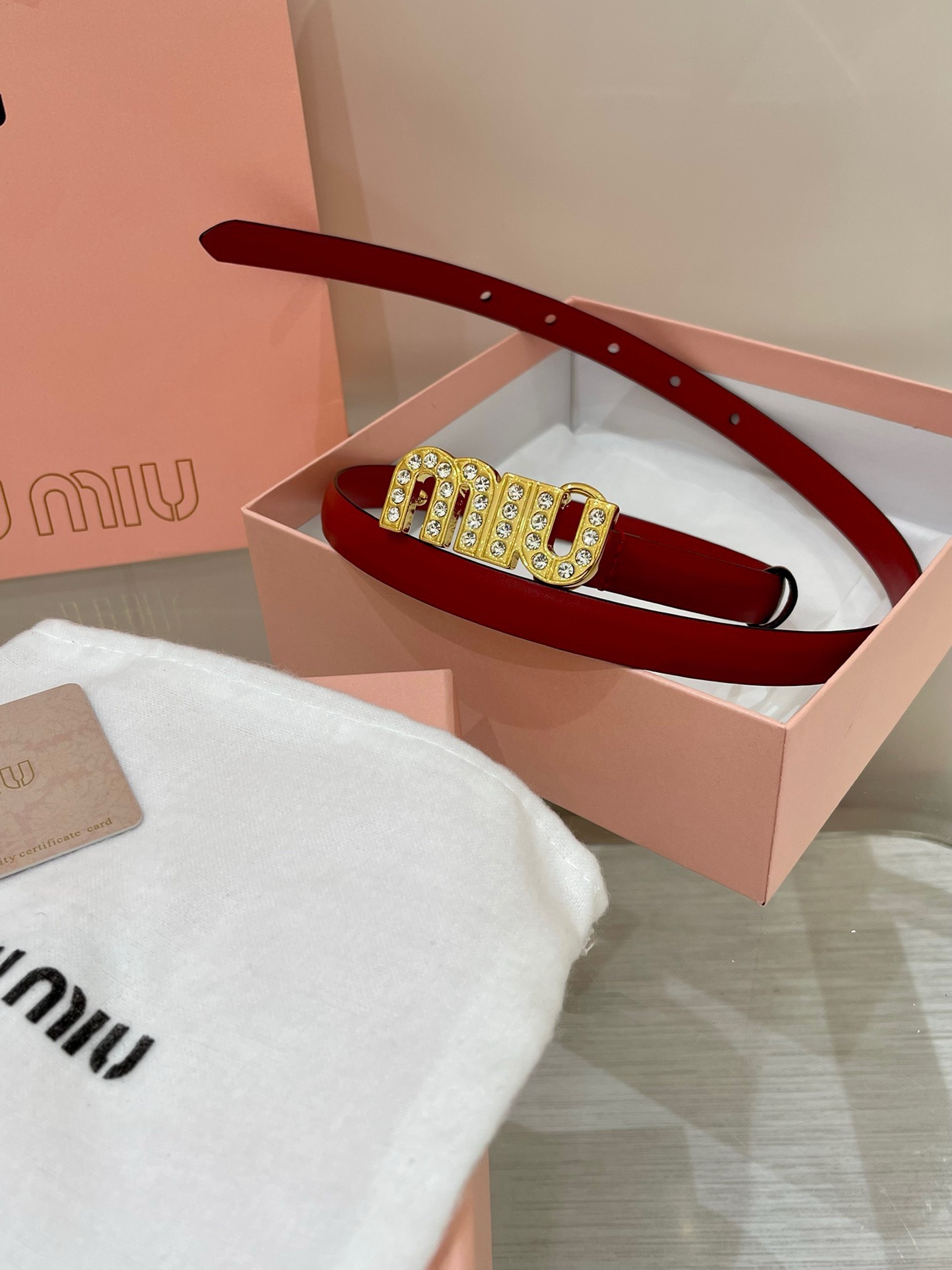 Miu Miu leather belt with a logo-engraved buckle.