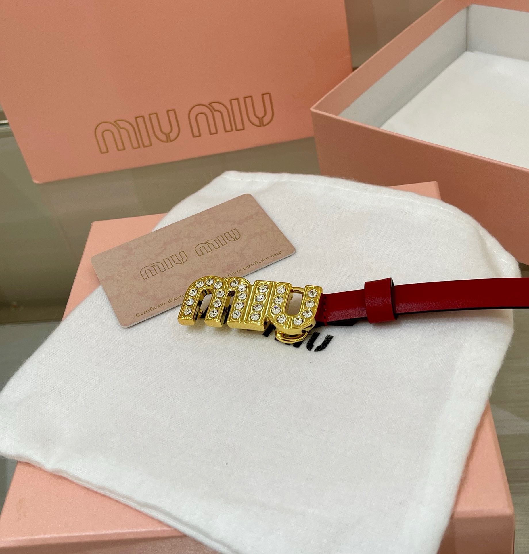 Miu Miu leather belt with a logo-engraved buckle.