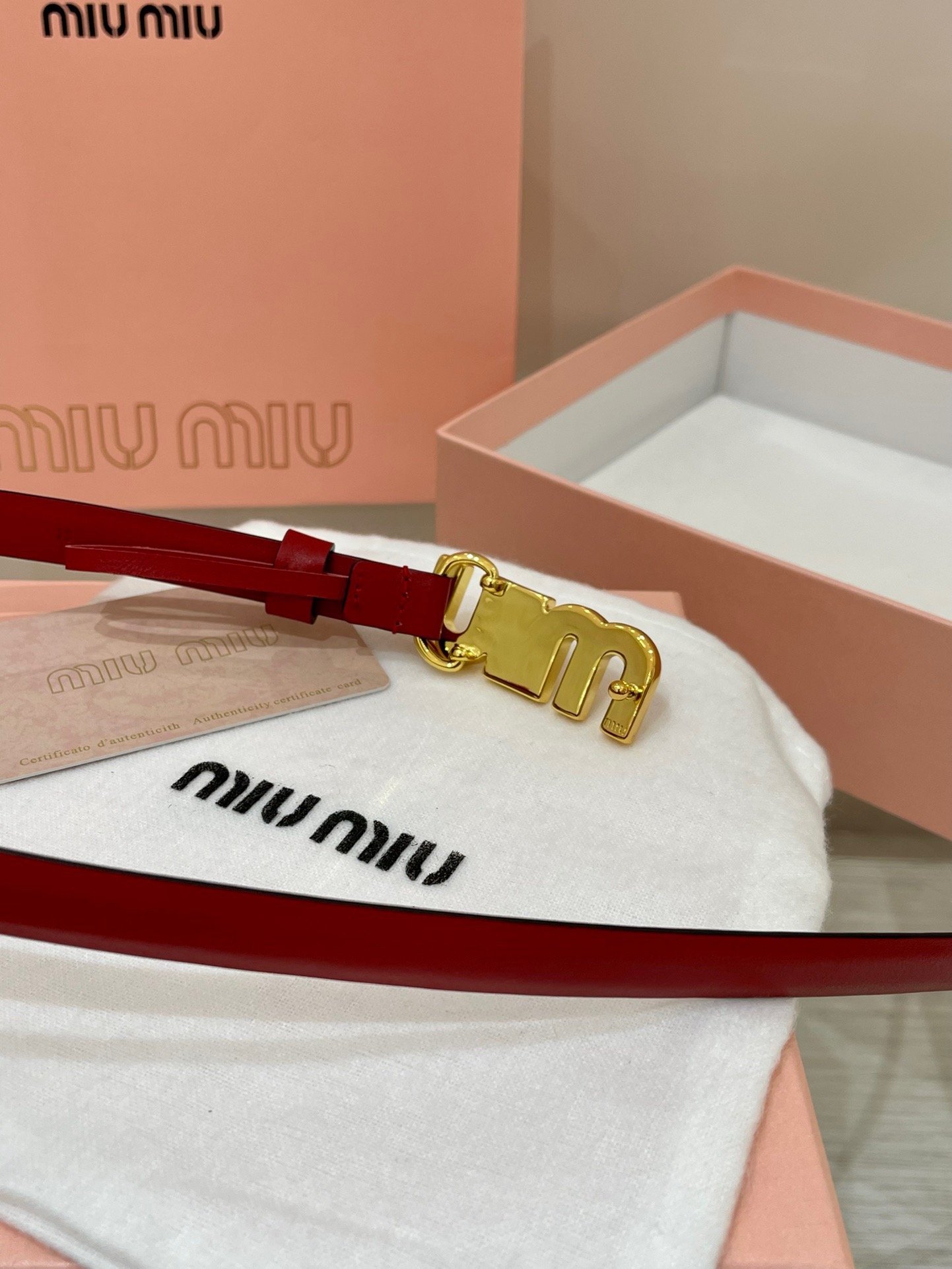 Miu Miu leather belt with a logo-engraved buckle.