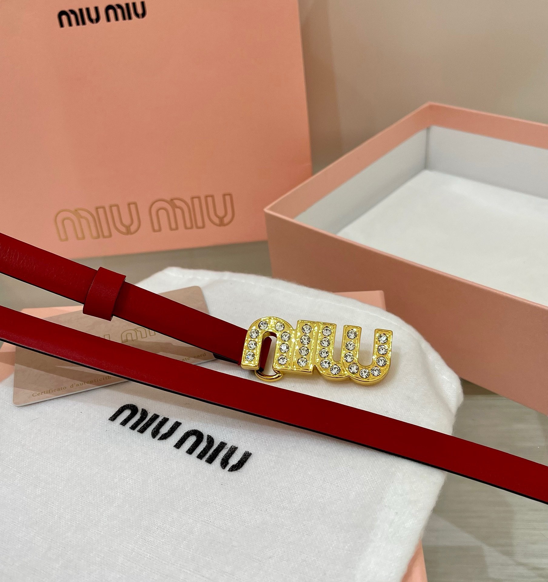 Miu Miu leather belt with a logo-engraved buckle.
