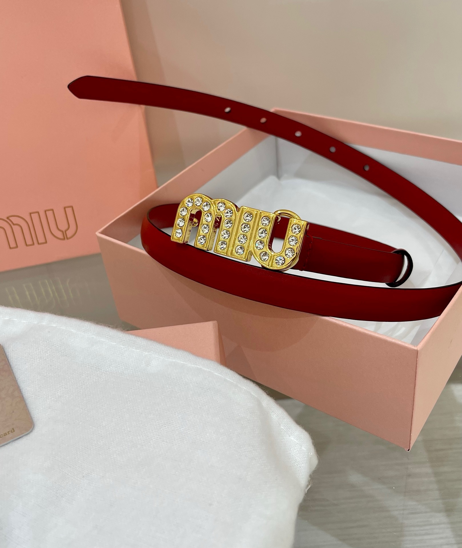 Miu Miu leather belt with a logo-engraved buckle.