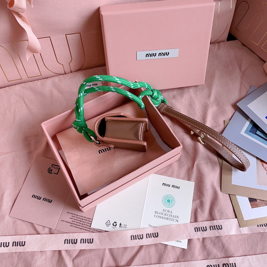 Miu Miu Mini-pouch leather, cord, and metal trick for Women - Brown in Shoes Miu Miu