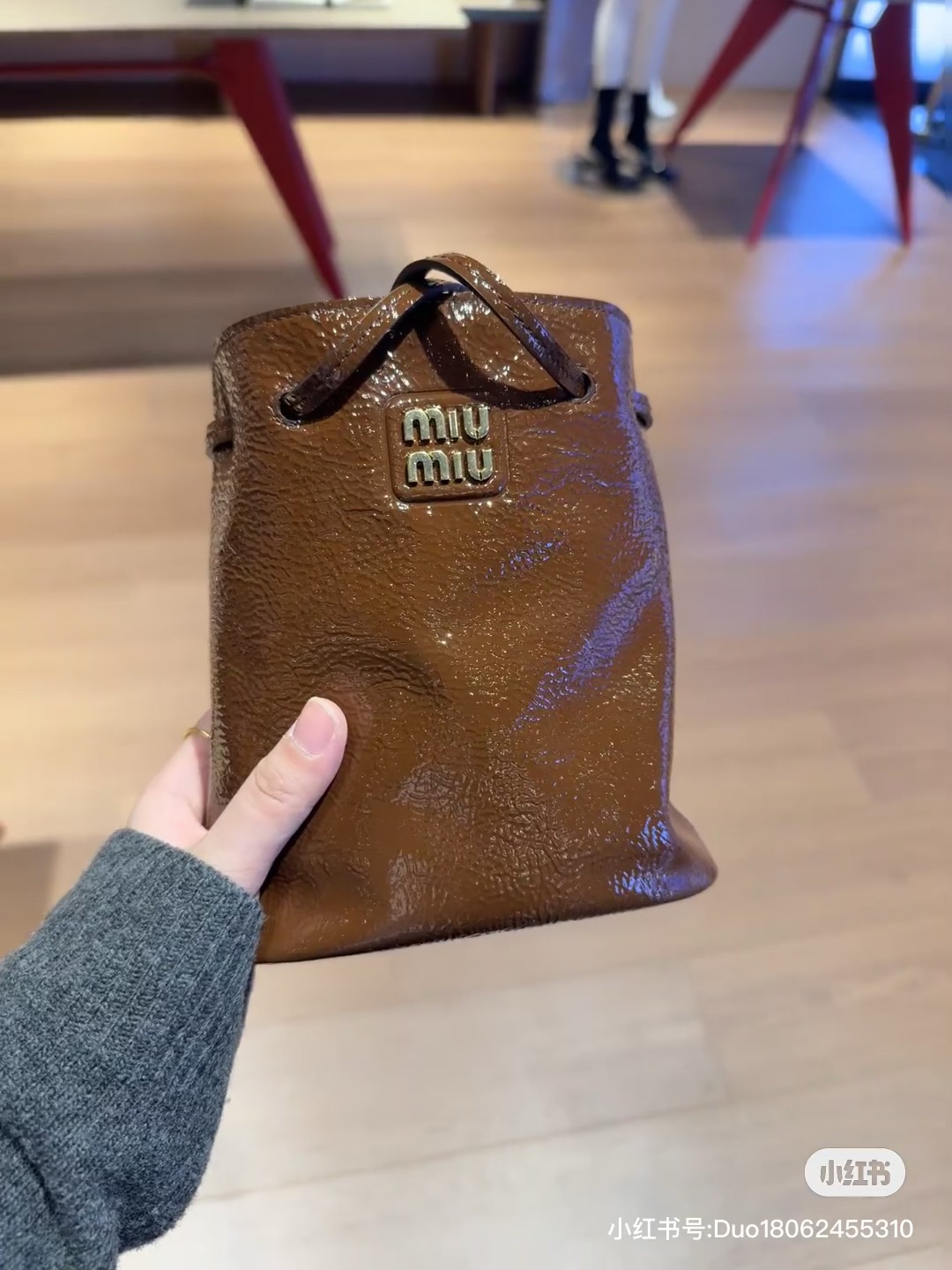 Miu Miu Naplak Patent Leather Pouch in Brown |