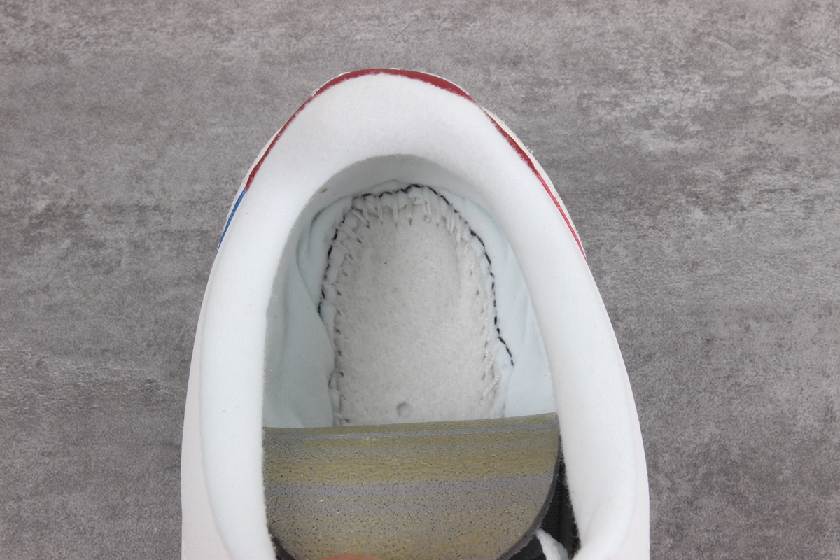 Nike Cortez leather trainers in white with red swoosh