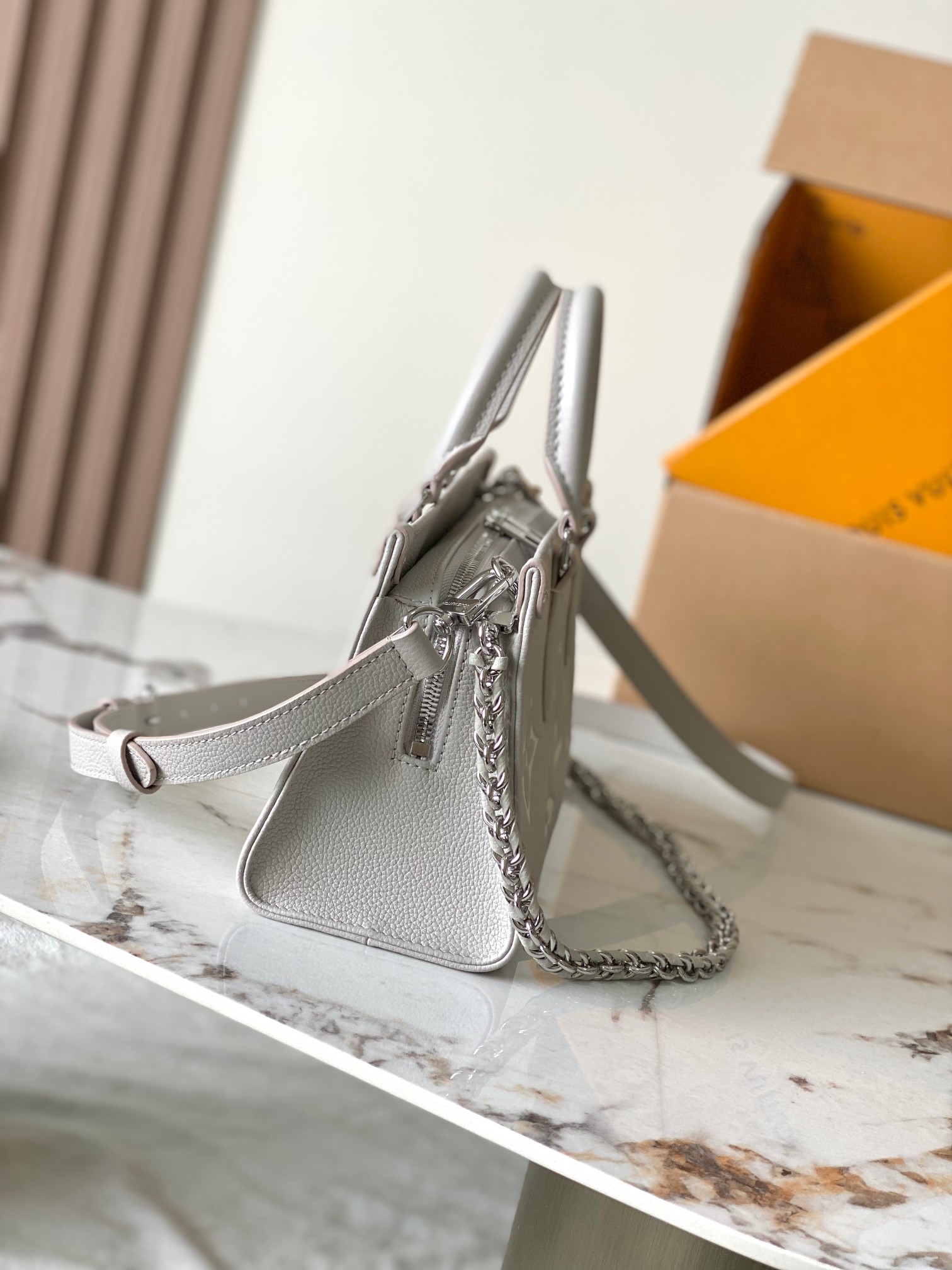 OnTheGo East West Bicolor Monogram Empreinte Leather