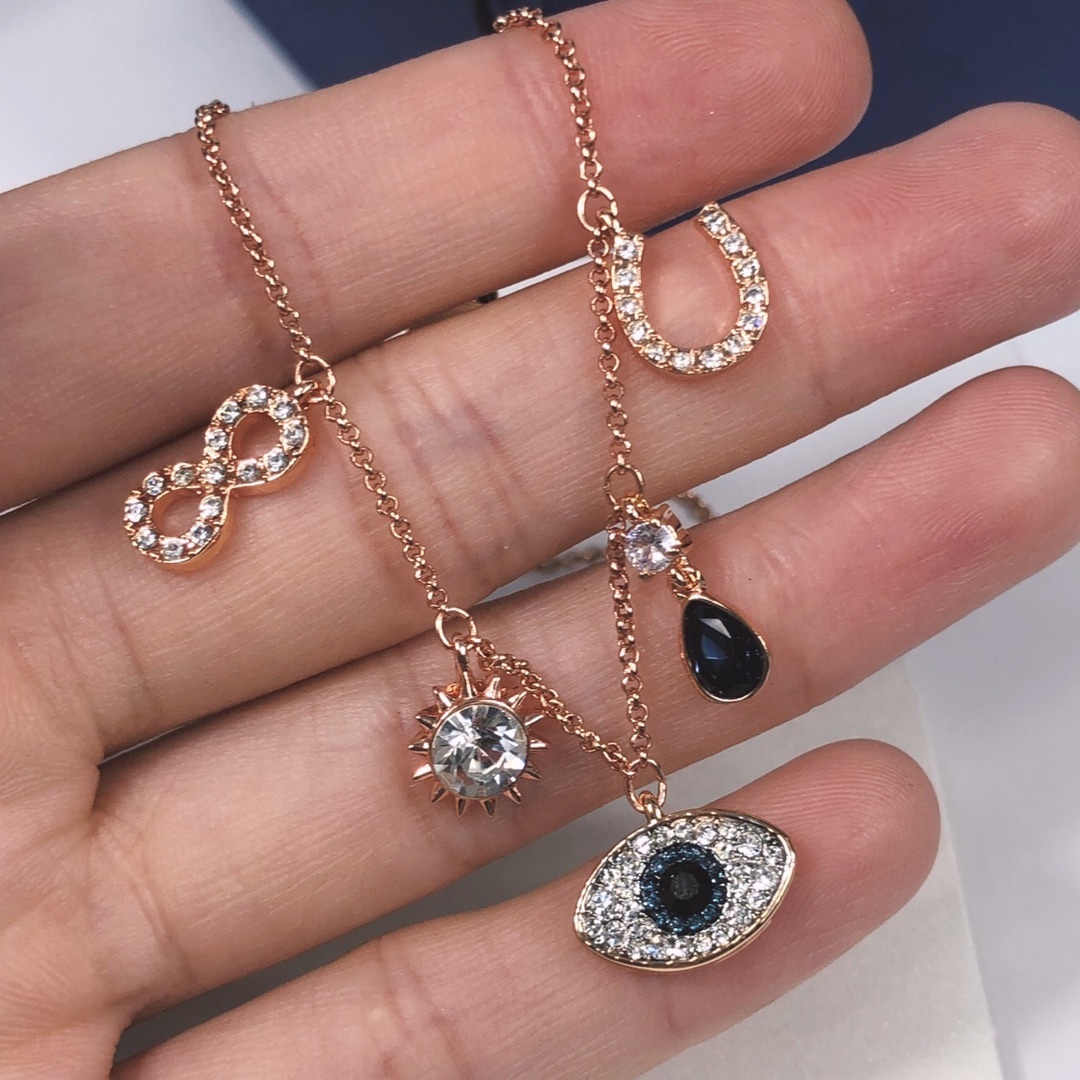 Rose Gold Evil Eye & Sun Charm Bracelet with Crystal Accents