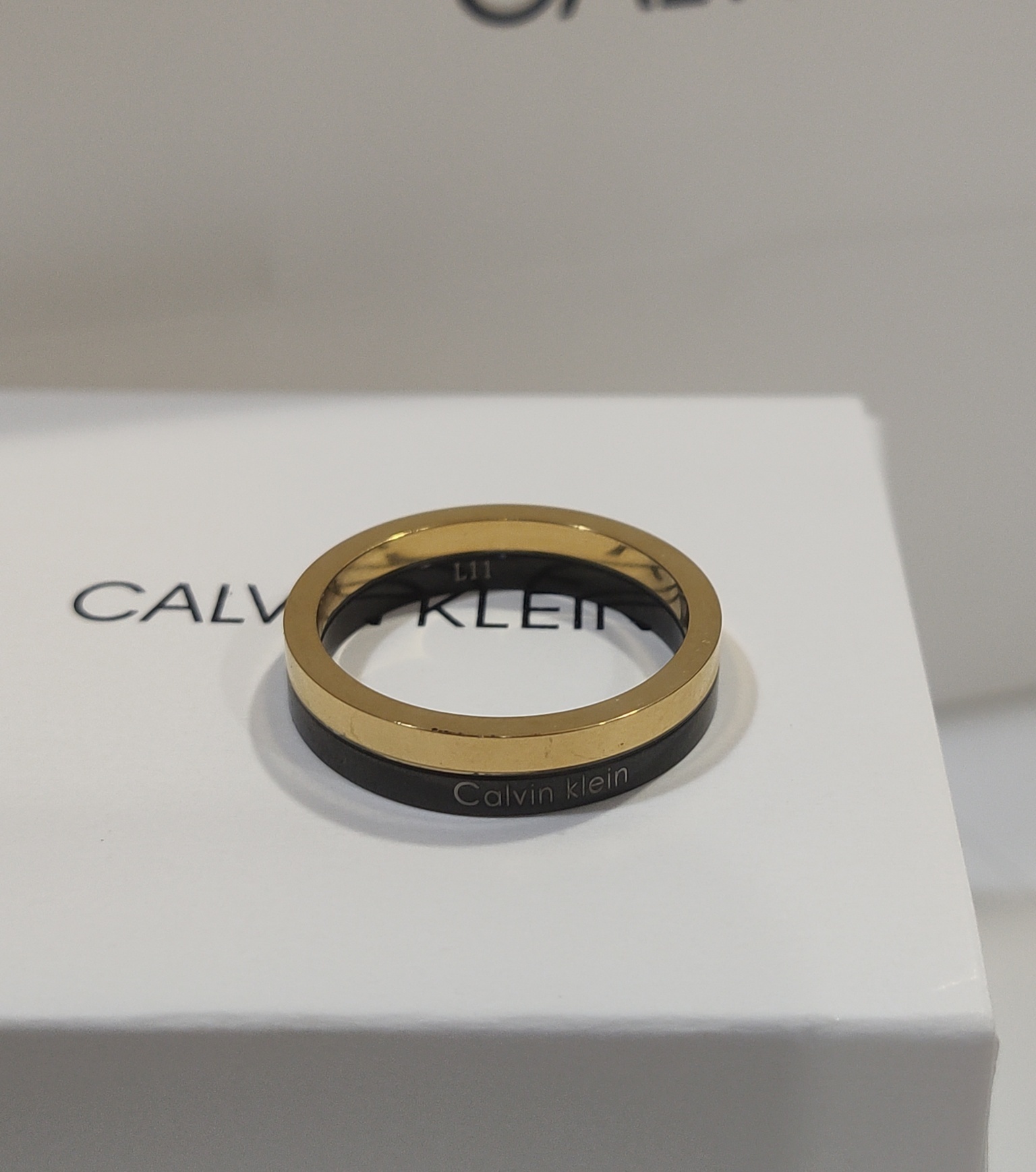 Calvin Klein Gold Black Ring – Calvin Klein Gold & Black Band Ring