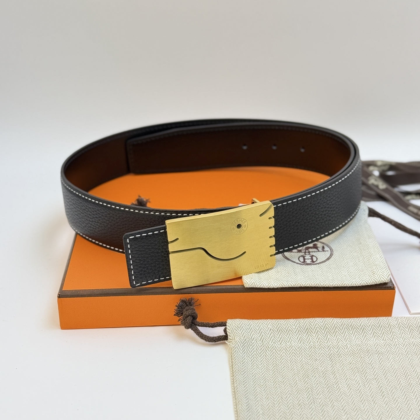 Hermès Men's Black Leather Belt with Unique Brushed Gold Buckle