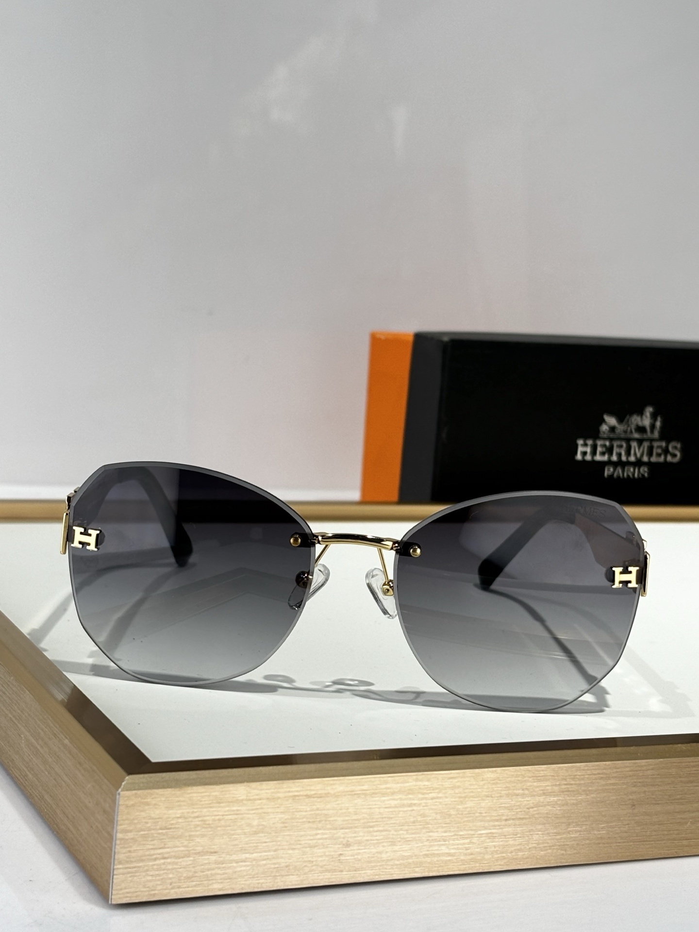 Hermès Gray Rimless Sunglasses – Gold H Logo