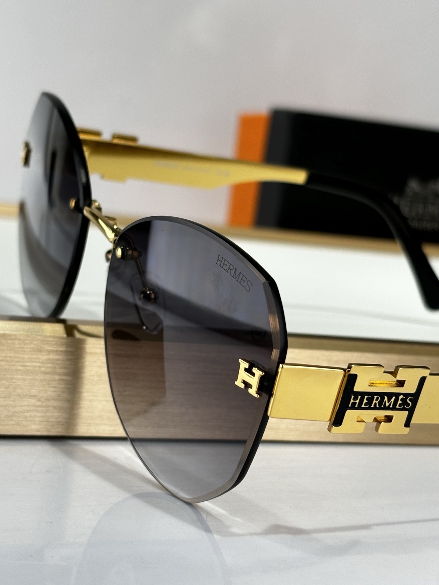 Hermes Luxury Rimless Butterfly Sunglasses – Gold & Grey Gradient