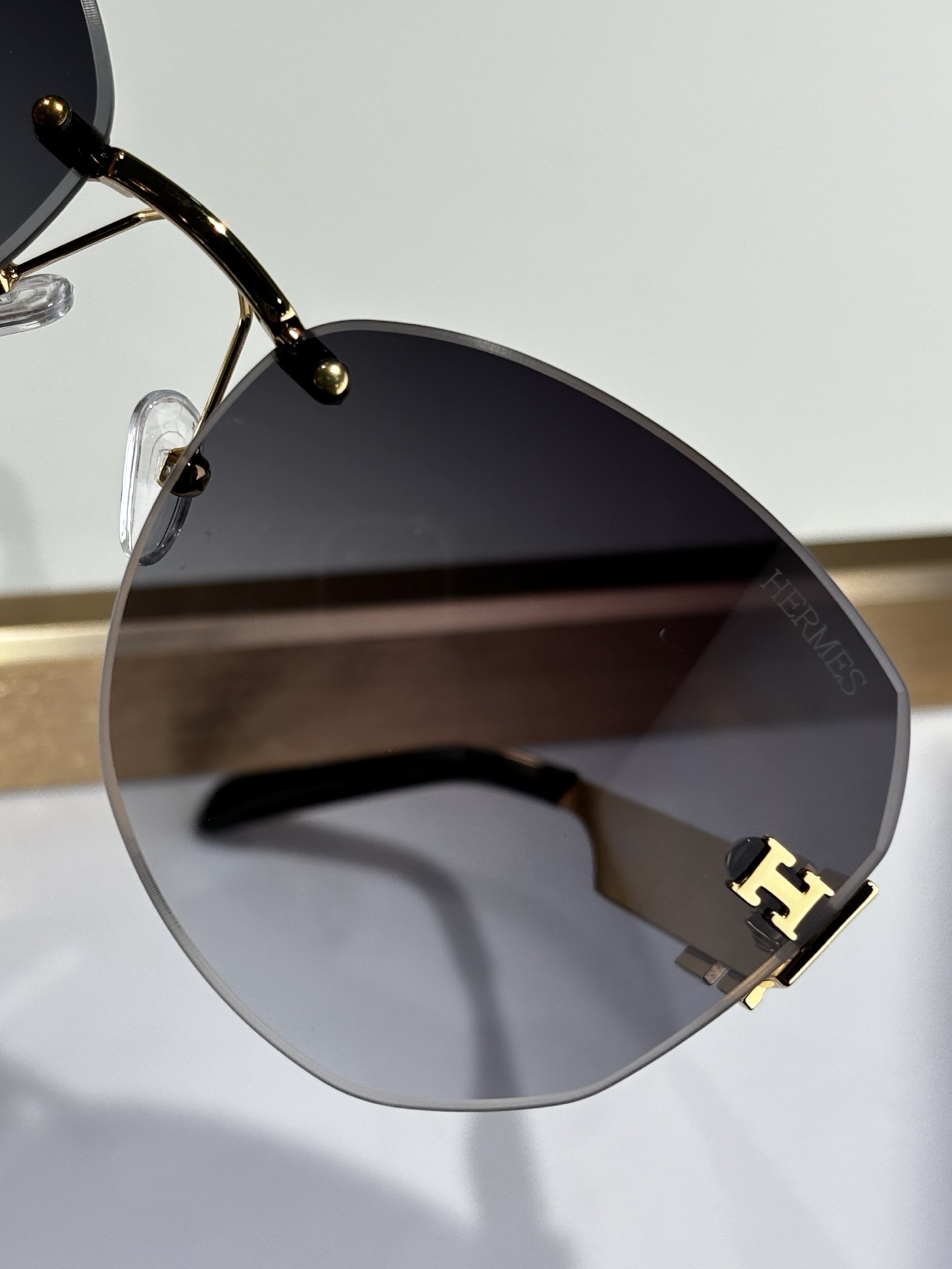 Hermes Luxury Rimless Butterfly Sunglasses – Gold & Grey Gradient