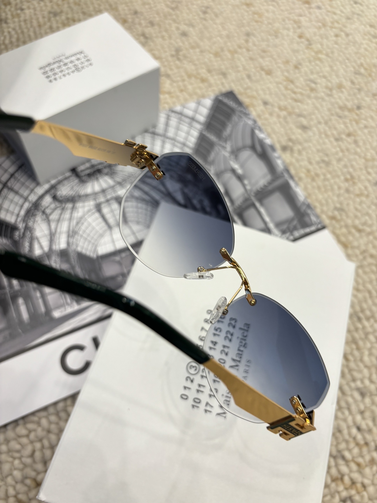 Hermes Rimless Cat-Eye Sunglasses with Gold H Logo & Blue Gradient
