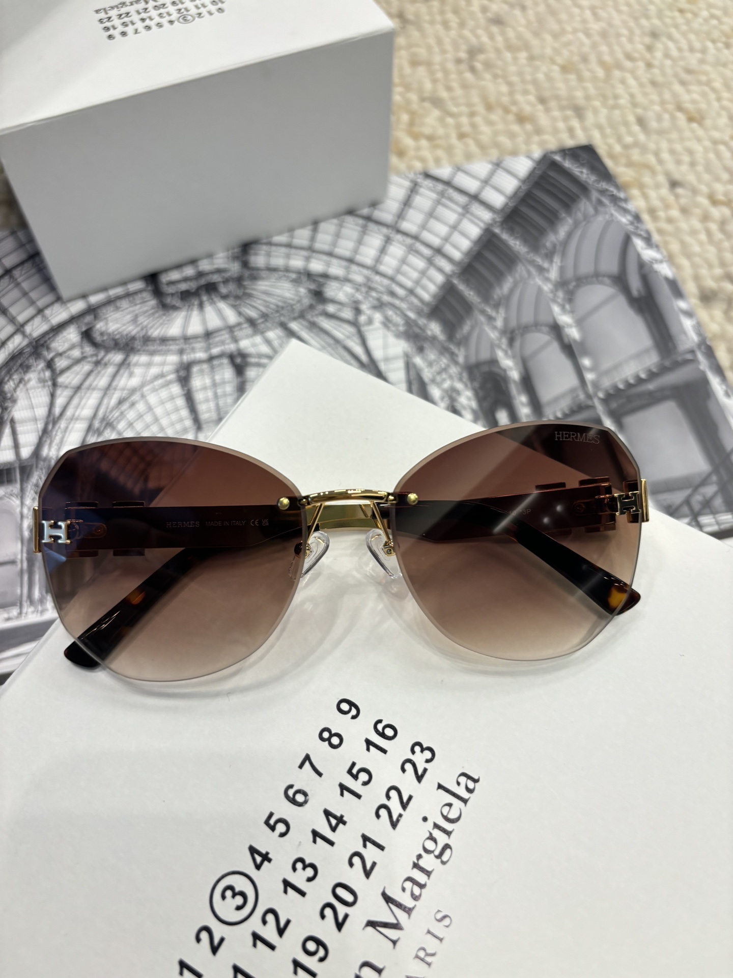 Hermès Rimless Butterfly Sunglasses – Brown Gradient with Gold H